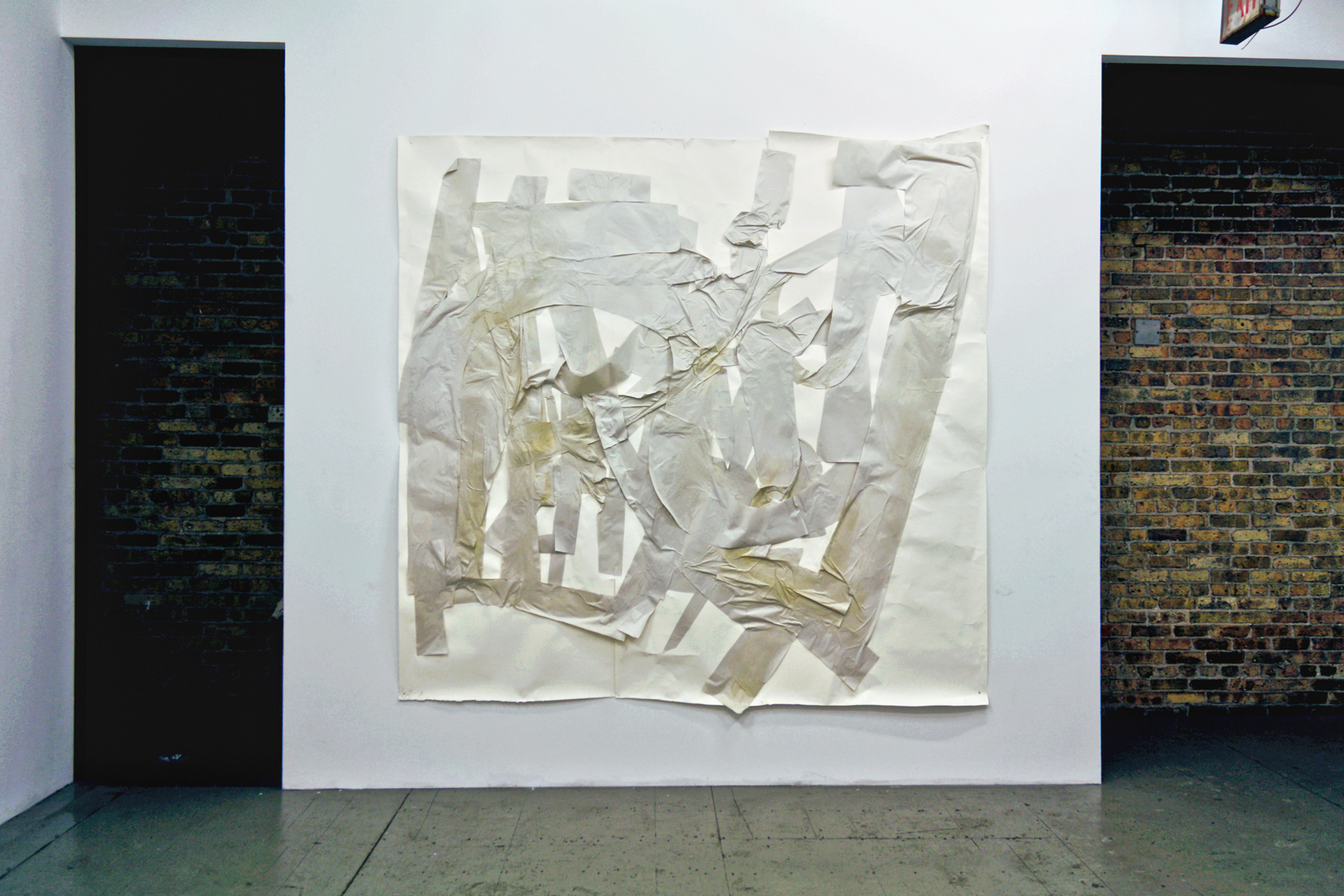 1/2 — TFDSM.  Utilizing a specific sentence, "The fox drinks snake's milk," as the starting point, TFDSM investigates language, communication, and physical gesture through analog processes. The project employs newsprint because of its fragility and role historically as a material typically filled with information and language, becoming seemingly ubiquitous. With the tradition of drawing in mind, individual letters are cut by hand, without a preplanned font or form, then intuitively composed.  Installation view from the exhibition Skin Tight at New Capital, Chicago, IL, 2013.