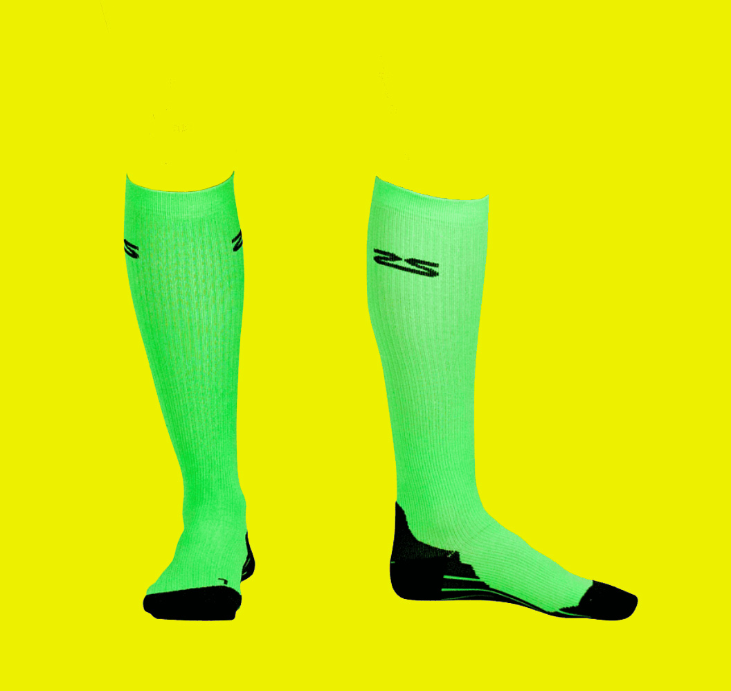 Artist Statement (A yellow box with neon green compression socks with black toes and logos.)