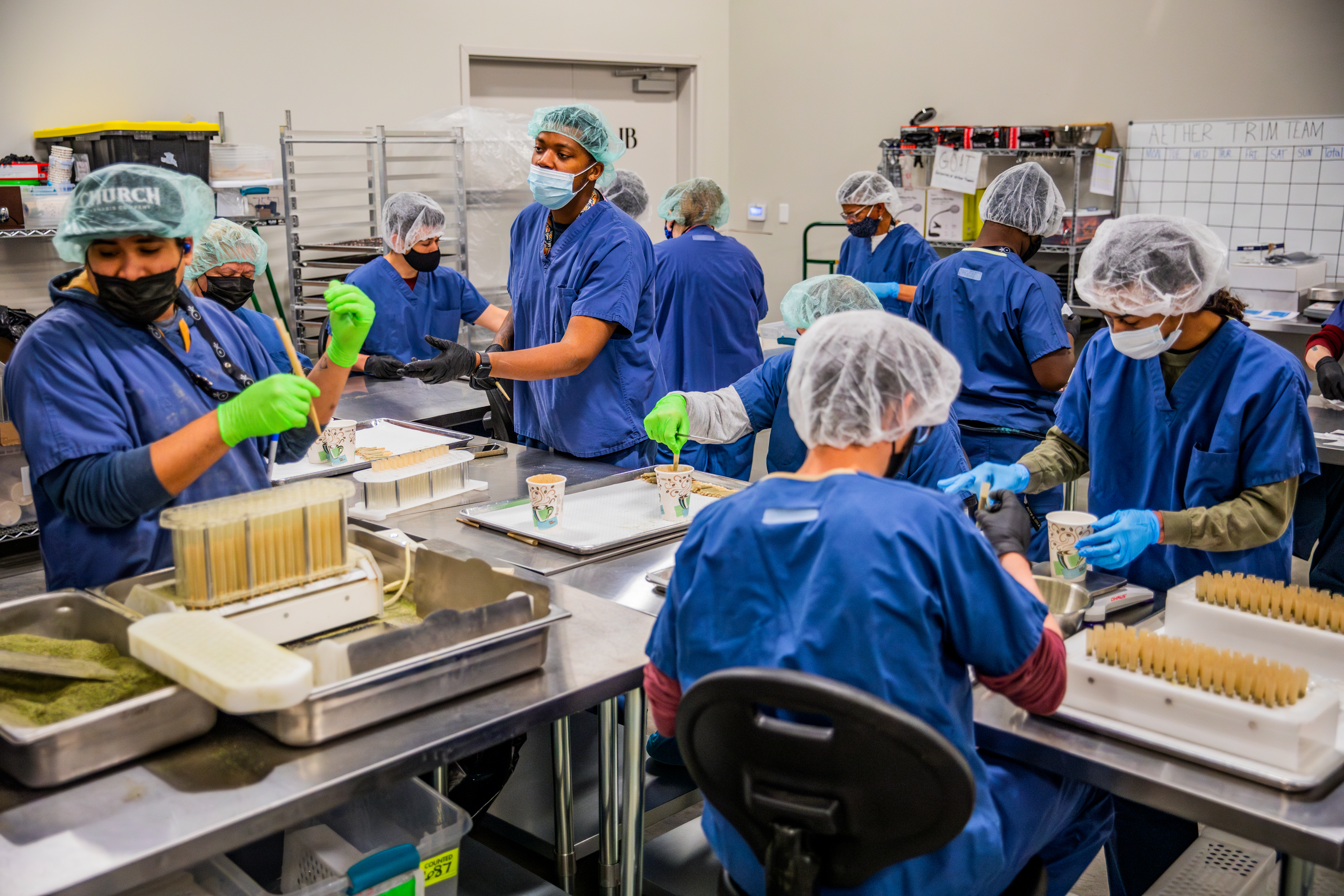Employees roll joints at Aether Gardens in Las Vegas.  The cannabis producer operates out of a 120,000-square-foot facility 14 miles from the Las Vegas Strip. (The New York Times)