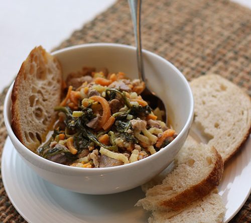 A simple picture of tasty chicken, sweet potato and apple hash in a bowl
