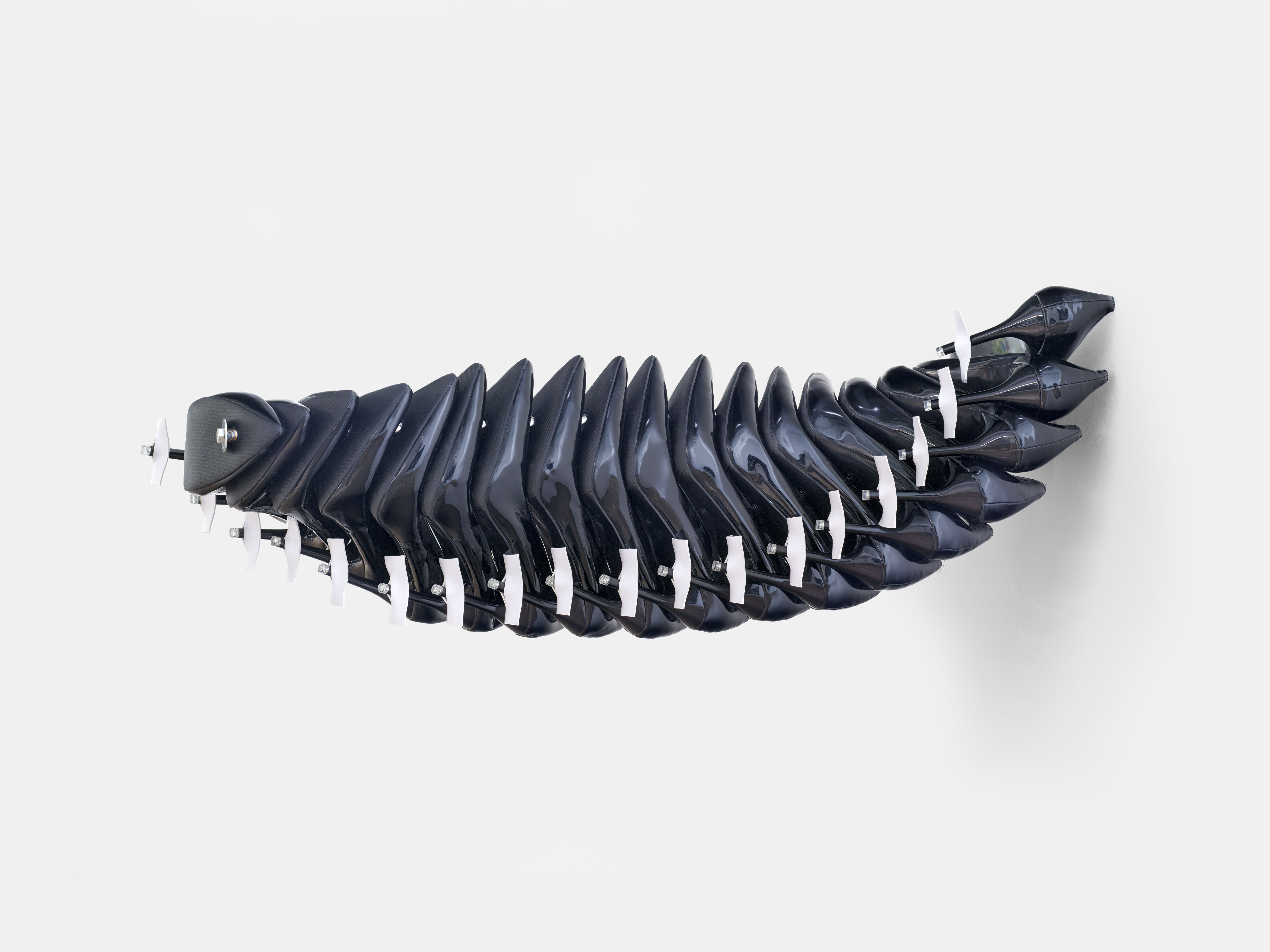 Prosody I, 2025   Dead stock high heels, leather belting and steel  46 x 46 x 80 cm  18.11 x 18.11 x 31.5 inches