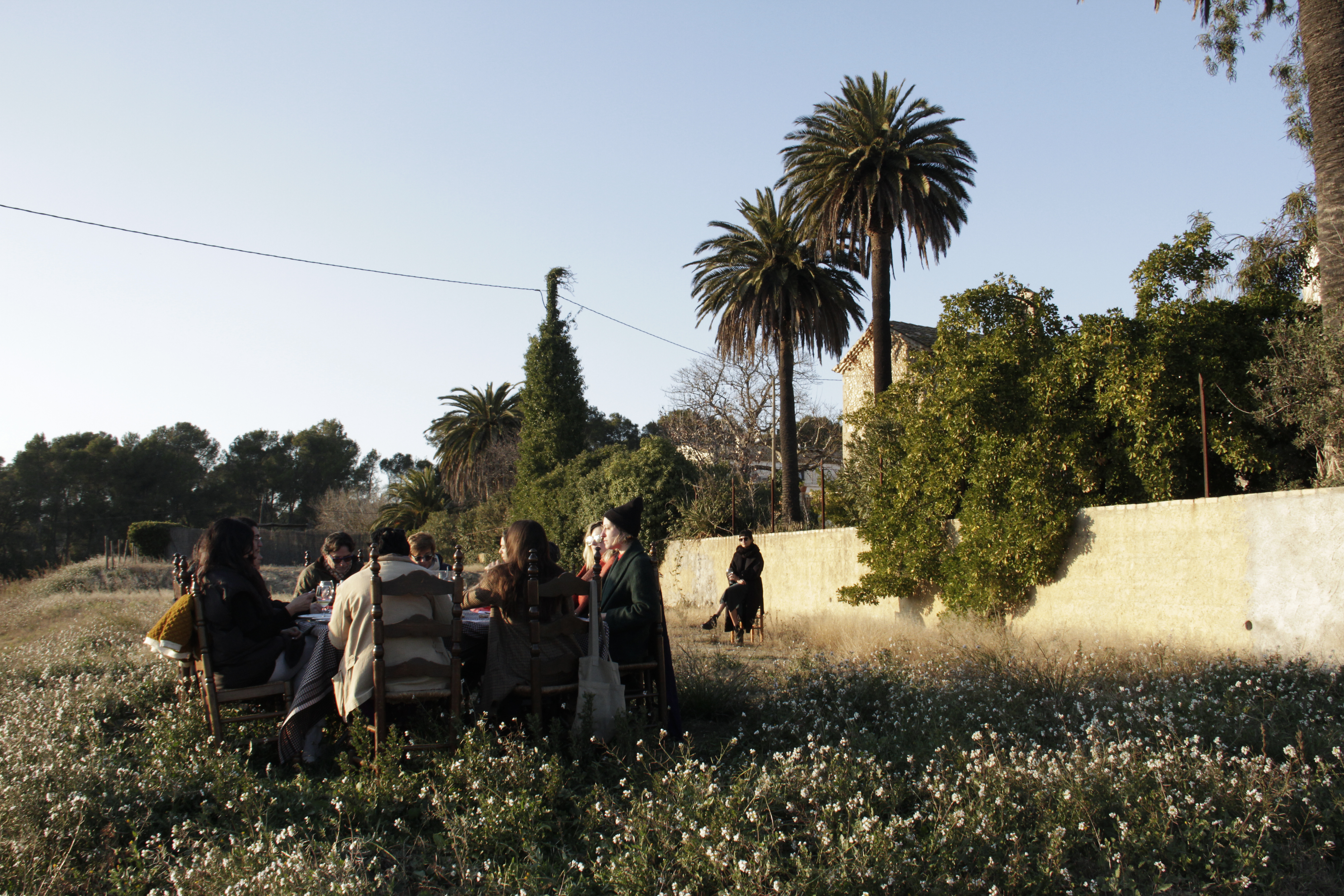 Performer sitting away from the table