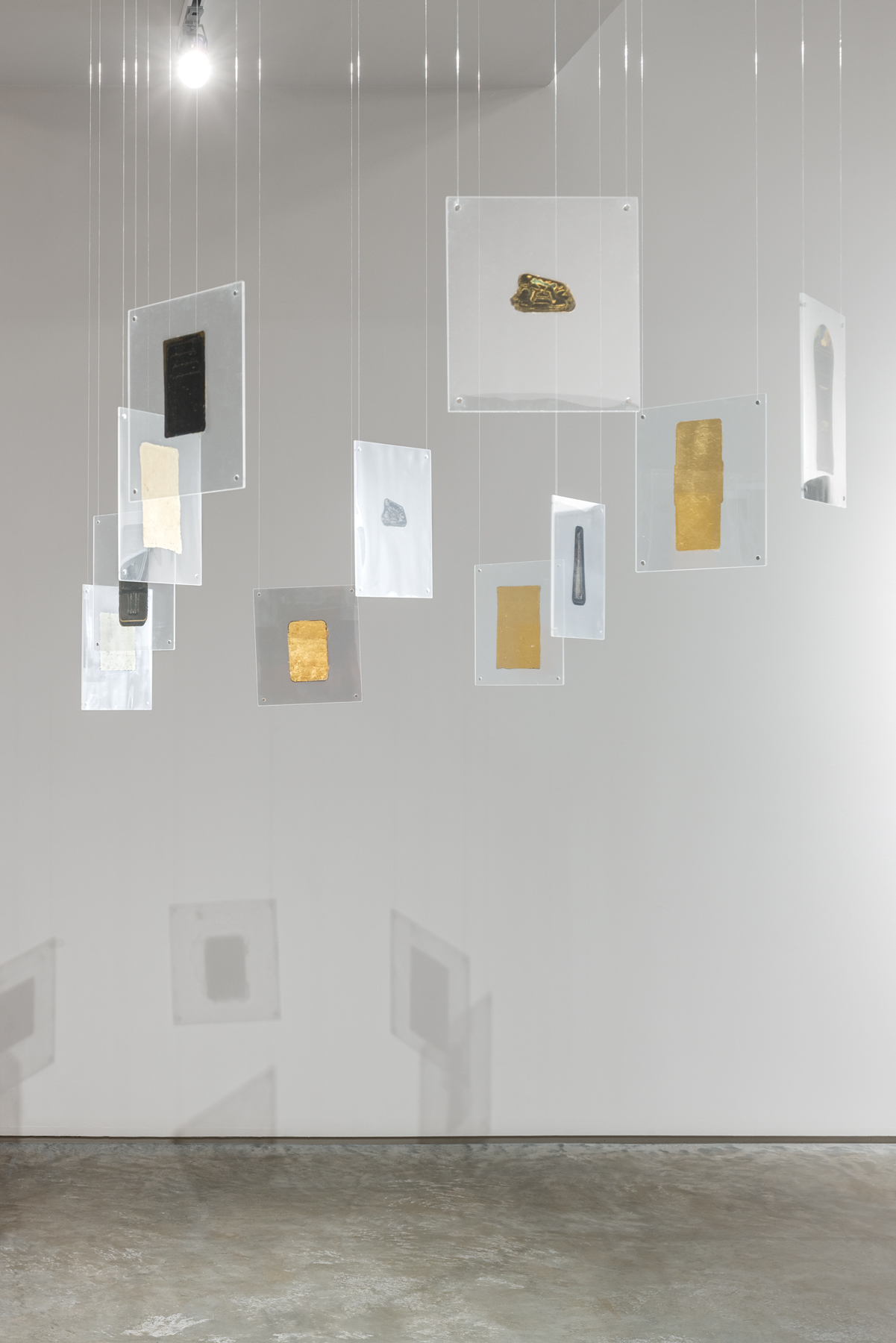 Robert Blake, "Oracle," ca. 2012. Gold leaf on acetate encased in plexiglass, 9 1/2 x 8 1/2 inches each. Photo by Rafael Gamo.