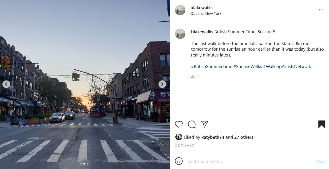 Instagram post by @blakewalks. A New York City street at an intersection with the crosswalk in the foreground. At the end of the street the sun is just starting to be visible on the horizon. Text reads: "blakewalks's profile picture blakewalks British Summer Time, Season 5  The last walk before the time falls back in the States. Jlin me tomorrow for the sunrise an hour earlier than it was today (but also really minutes later).  #BritishSummerTime #SunriseWalks #WalkingArtistsNetwork"