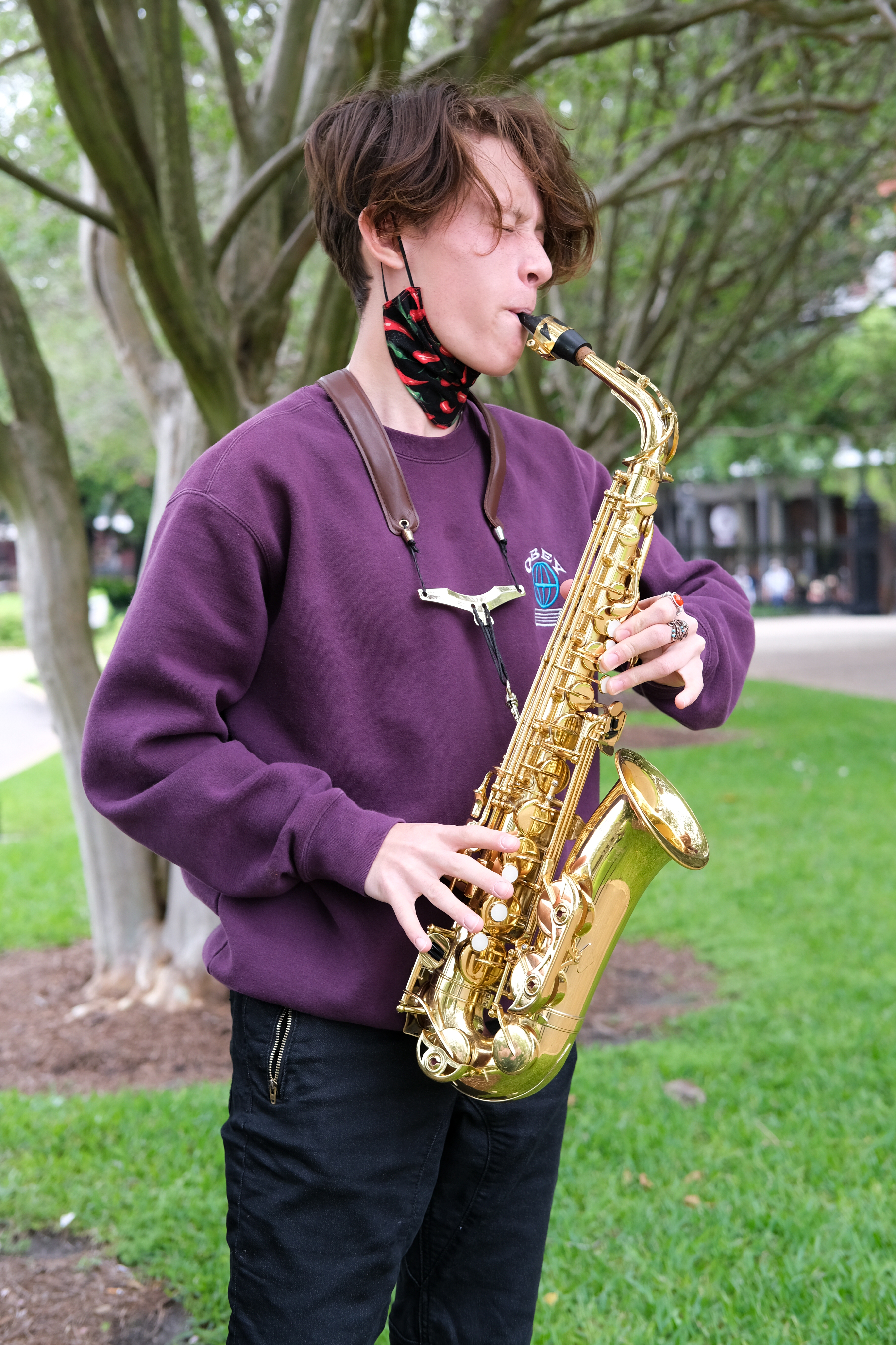 Jose, 17, plays his saxophone in Jackson Square, New Orleans. He's on vacation with his family from Panama City, FL.