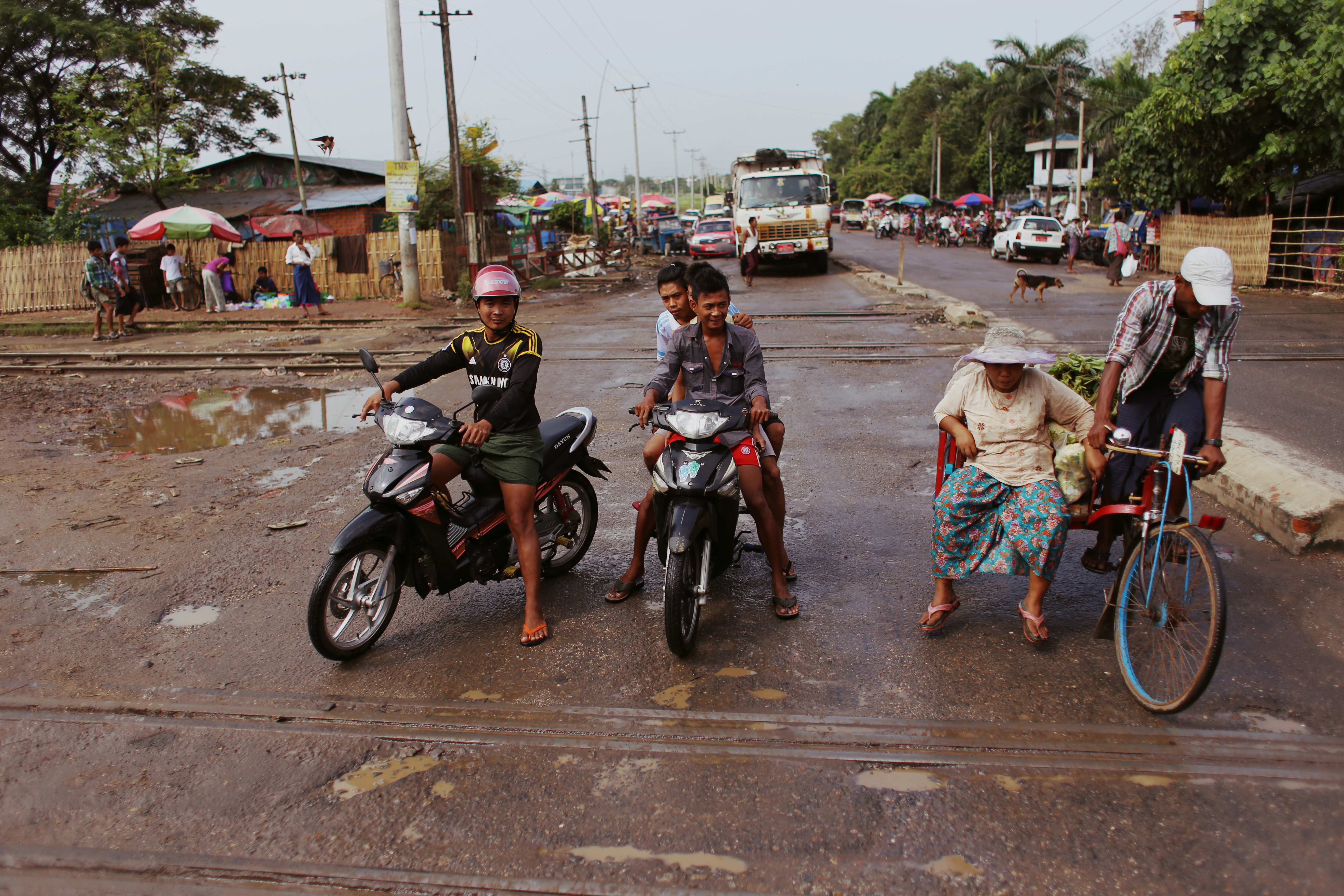 Cyclists wait for the train to pass at a level crossing just past Golf Course Station, named after the two nearby 18-hole courses in the city’s far north. Potholes are common and road conditions are often poor, but traffic is considered light compared to other Southeast Asian cities. Still, a commuter does tell me that he thinks there are too many cars on the roads - the journey from the airport to the downtown area that used to take 30 minutes now takes an hour.