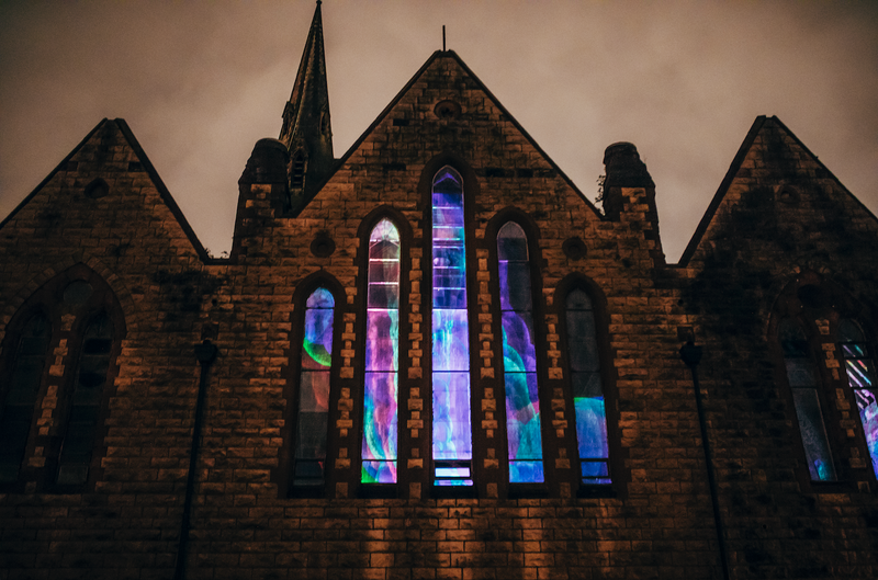 Colourful light projections transforming the windows of Carlisle Memorial Church for Red Bull x Max Cooper’s immersive audiovisual show.