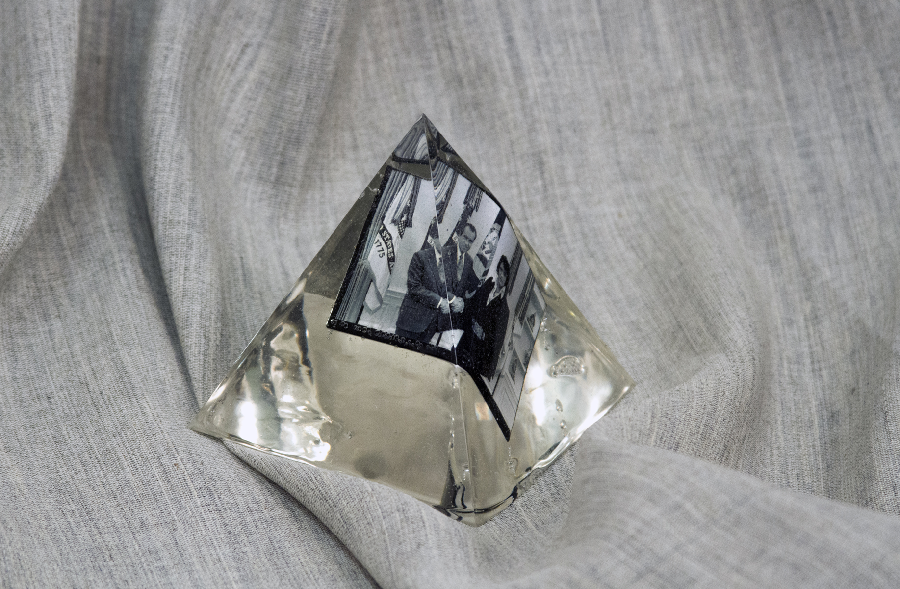 Detail of Intimate Locus (Head Rest), 2018, dimensions variable. Wood, screws, concrete blocks, c-clamps, polyester, commemorative magnet, epoxy resin, oil on panel