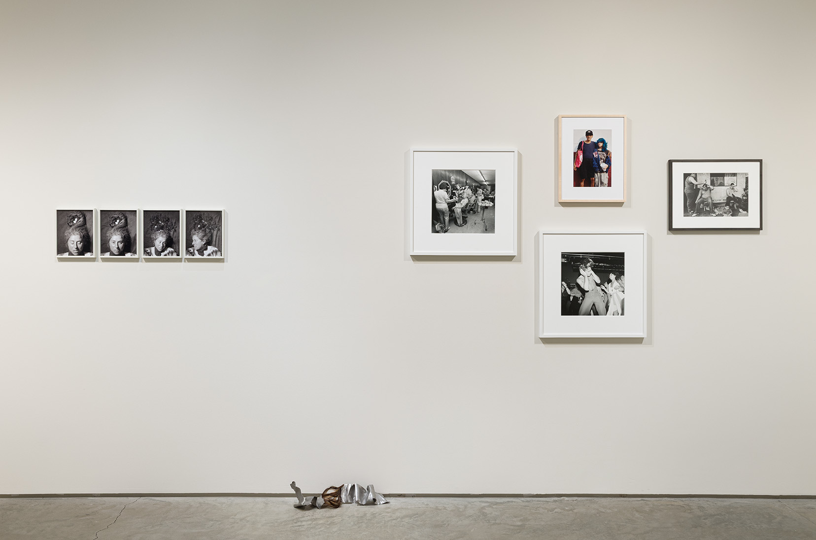 (Left) Cristina de Gennaro,  Carol, #2, #3, #5 ,#6 from the Medusa Series, 2012. Chromogenic print, 10 x 8 inches each.  Magdalena Dukiewicz, Object#16, 2024. Artist’s hair, steel, 18 x 9 x 6 inches.  (Right) (Left) Meryl Meisler, Mom Getting her hair Teased at Besame Beauty Salon, North Massapequa, NY, June 1979, 1979. Gelatin silver print, 16 x 20 inches. (Middle, top) Sara Messinger, Untitled (Mexico City, February 2023) , 2023. Chromogenic print, 11 x 14 inches (image) 14 x 18.75 inches (framed). (Middle, bottom) Meryl Meisler, J.J. Studio 54, 1977. Gelatin silver print, 16 x 20 inches. (Right) Joseph Rodriguez, Gyro gets a haircut to look for a job, 1993. Chromogenic print, 9.5 x 13.5 inches.  Photo by Etienne Frossard.