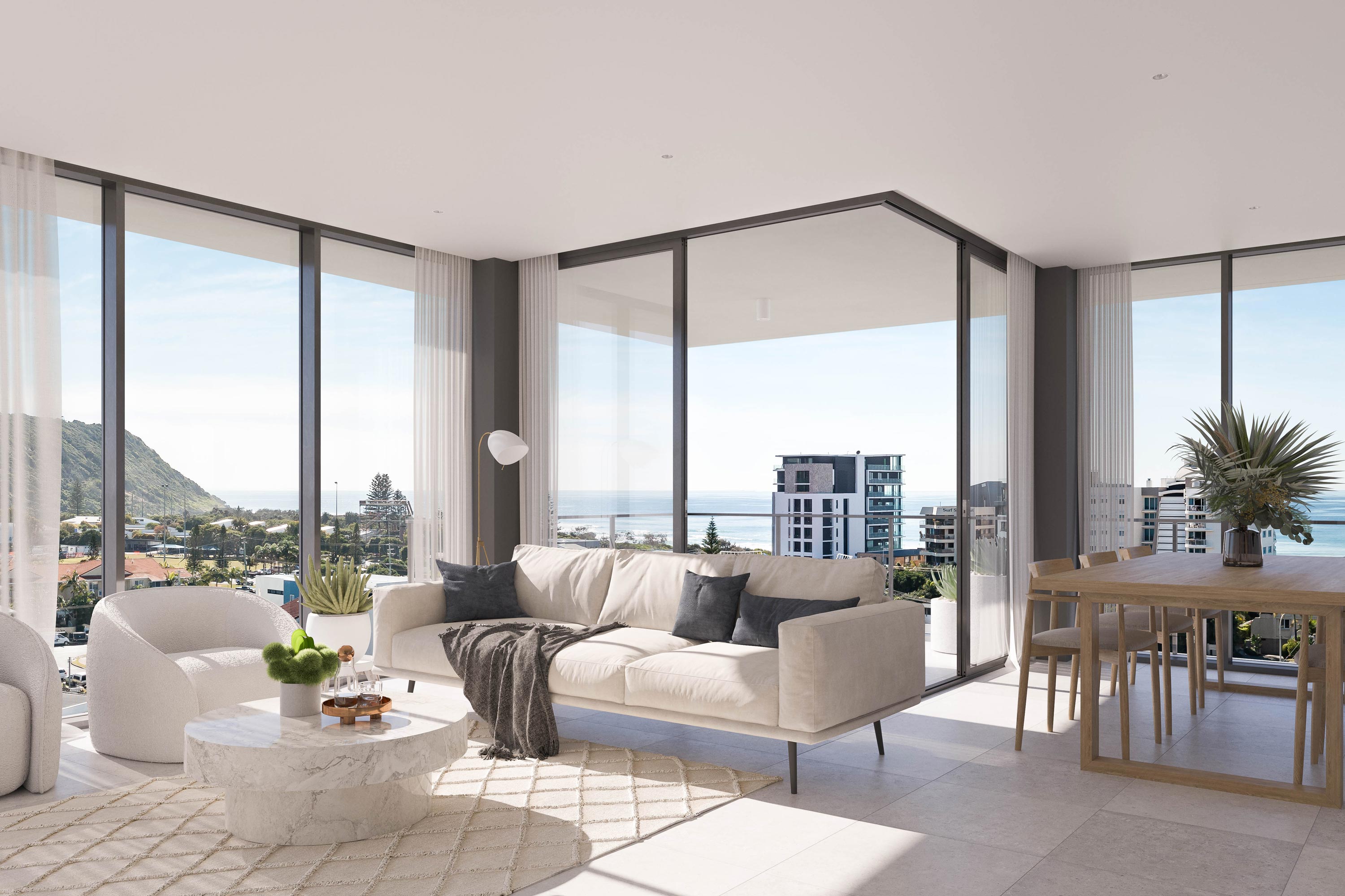 A contemporary living room with expansive ocean view through floor-to-ceiling windows.