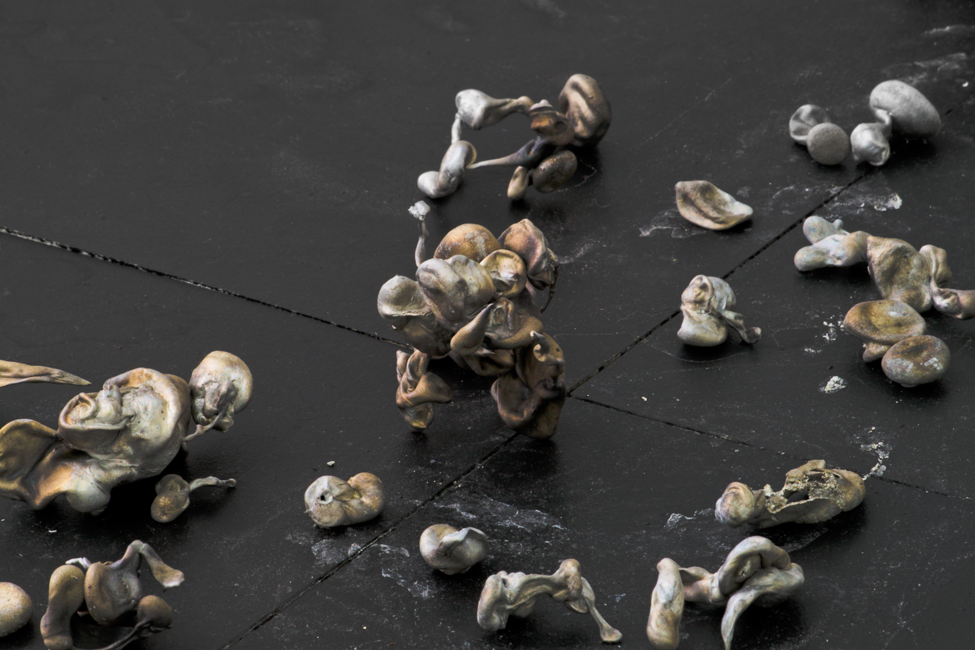 Value form phase transition, 2018; i) molten aluminum is poured into water, solidifying on contact, ii) the water is frozen, iii) the resulting sculpture is displayed in the gallery at room temperature, melting and depositing pieces of aluminum according to its process; initial dimensions 20 x 9 x 6 in. (51 x 23 x 15 cm)