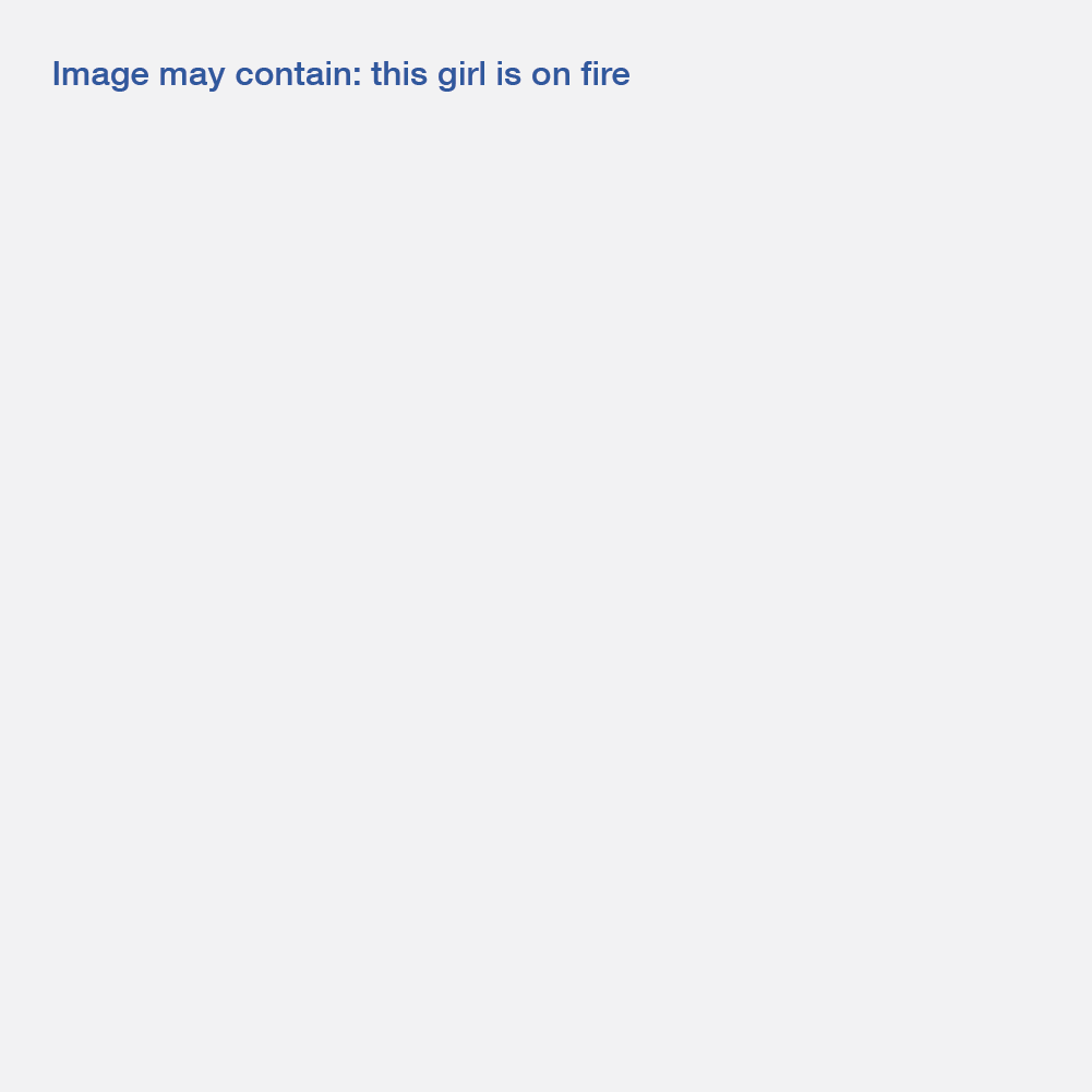 A grey square with blue text that says "Image may contain: this girl is on fire"