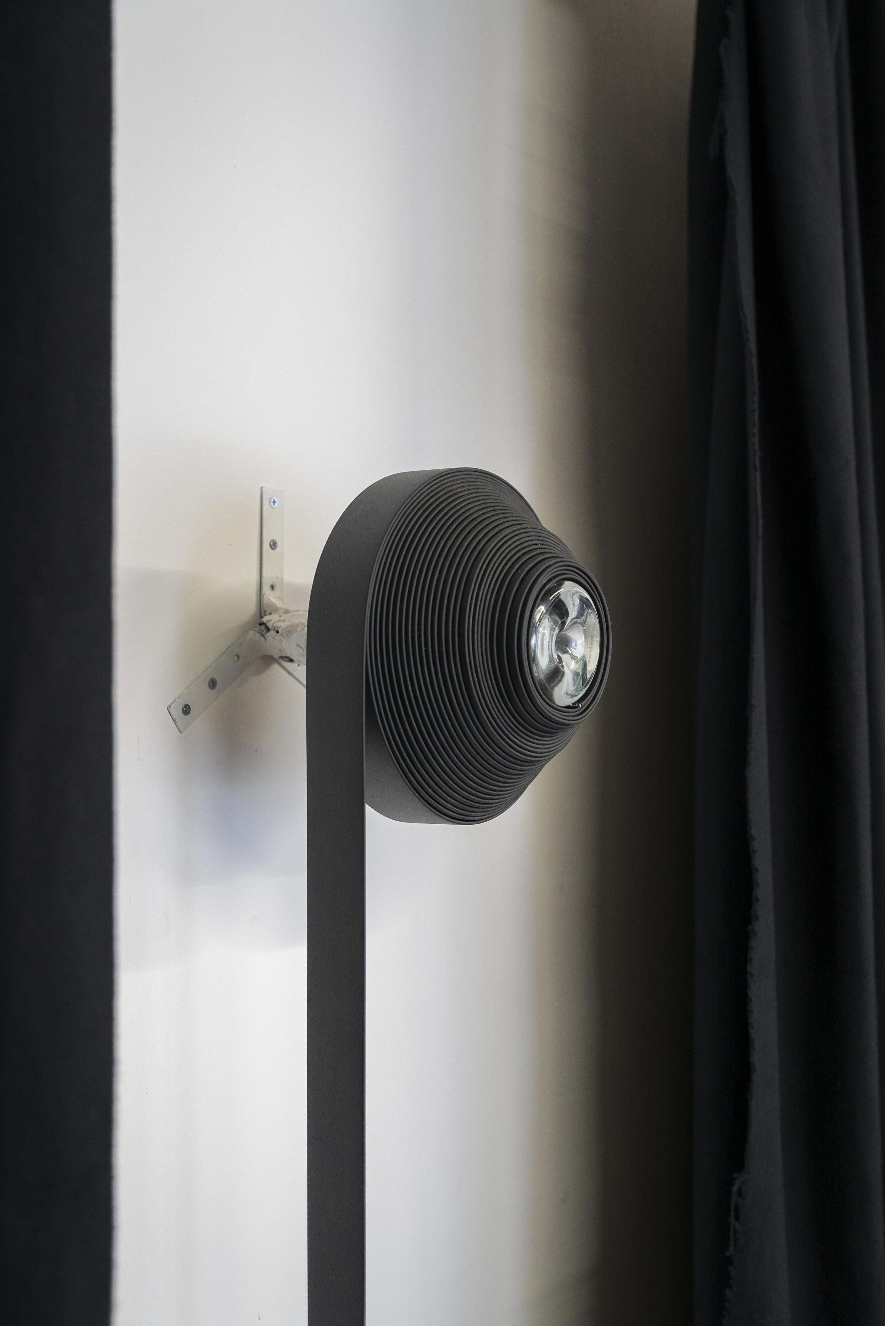 Crepuscule I, 2022, Machinery belting, Whisky glass, Wine bottle, Cork, Epoxy putty, Brackets.