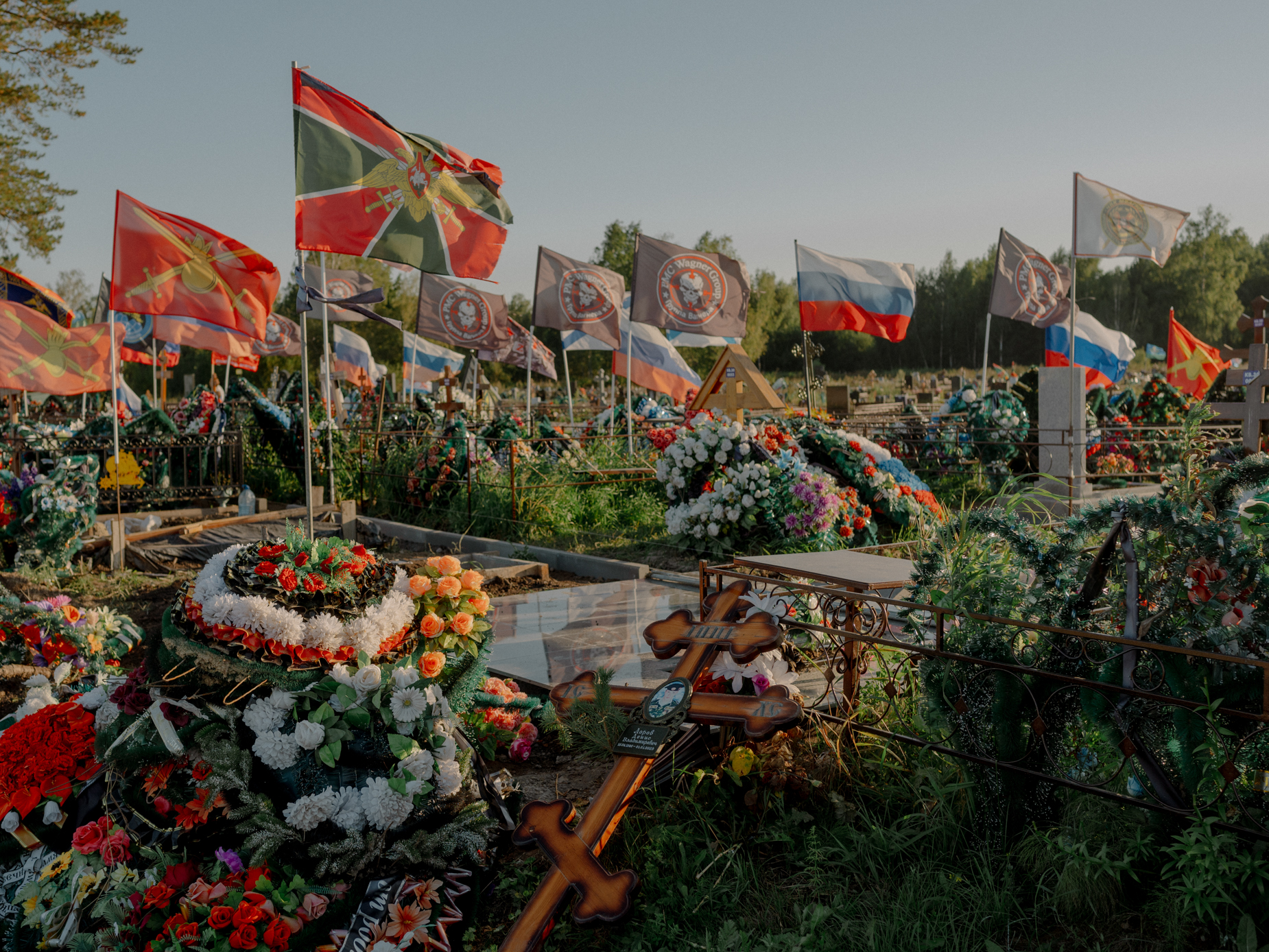 Graves of Russian soldiers, who died in Ukraine, at the city cemetery near Tomsk. The city authorities allocated a separate section number 39 for the soldiers, which can be easily recognized by the waving flags of the various branches of the Russian army and Wagner unit. - Tomsk, 30.08.23