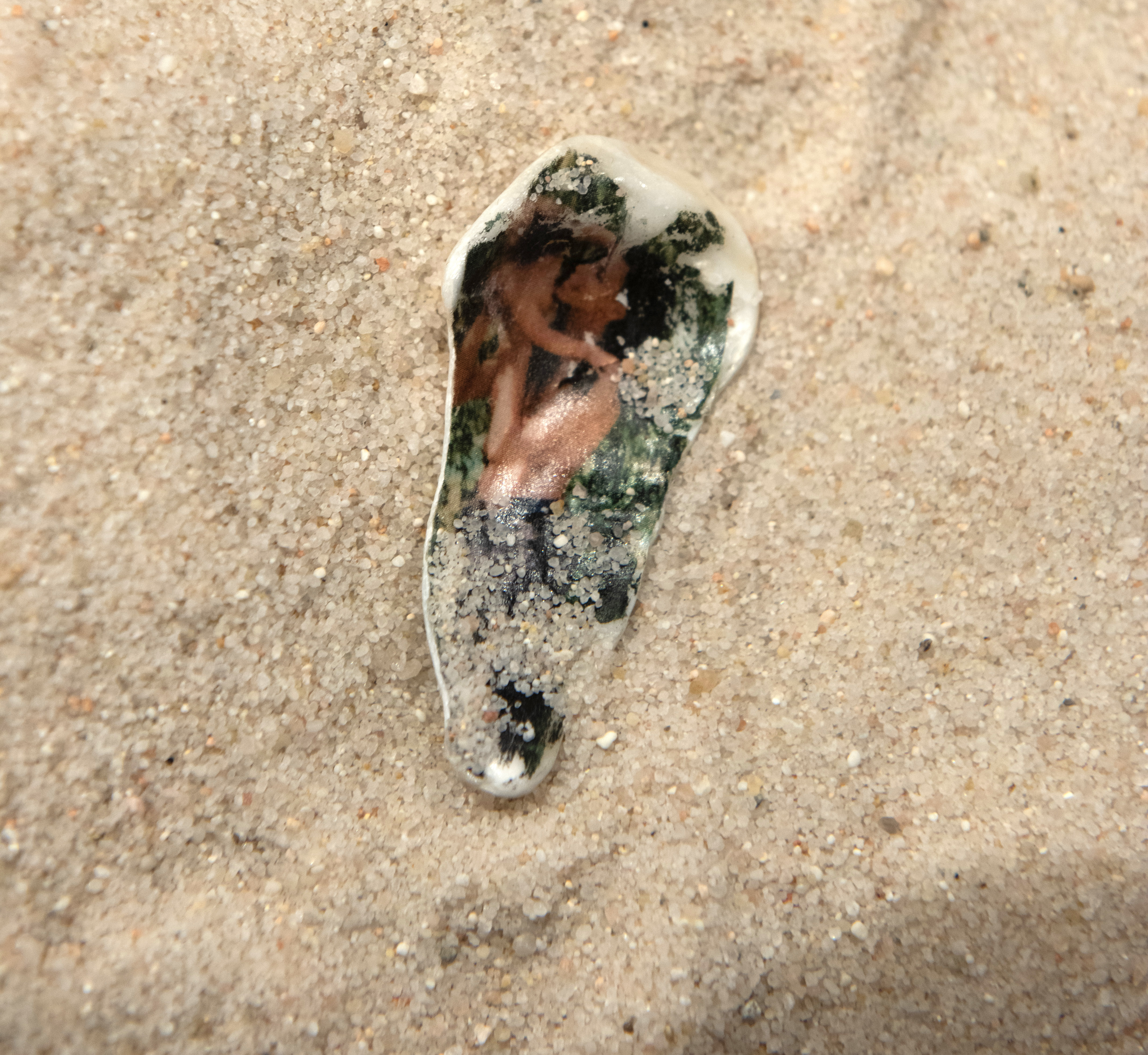 not a wasteland, but a poem - installation, photo printing on seashells and mirror (2023)