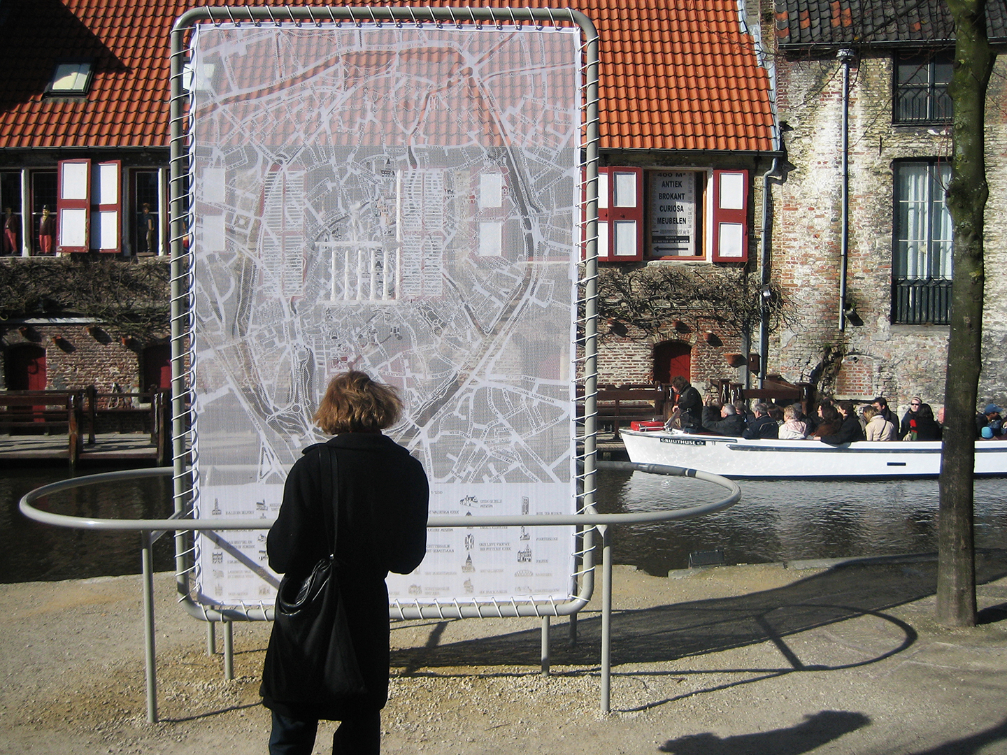 Lace MapA gigantic city map of Bruges, lace capital of Belgium, where streets, alleyways, street and as well as monuments and street names are knitted into a lace pattern onto which tourists can find their way.