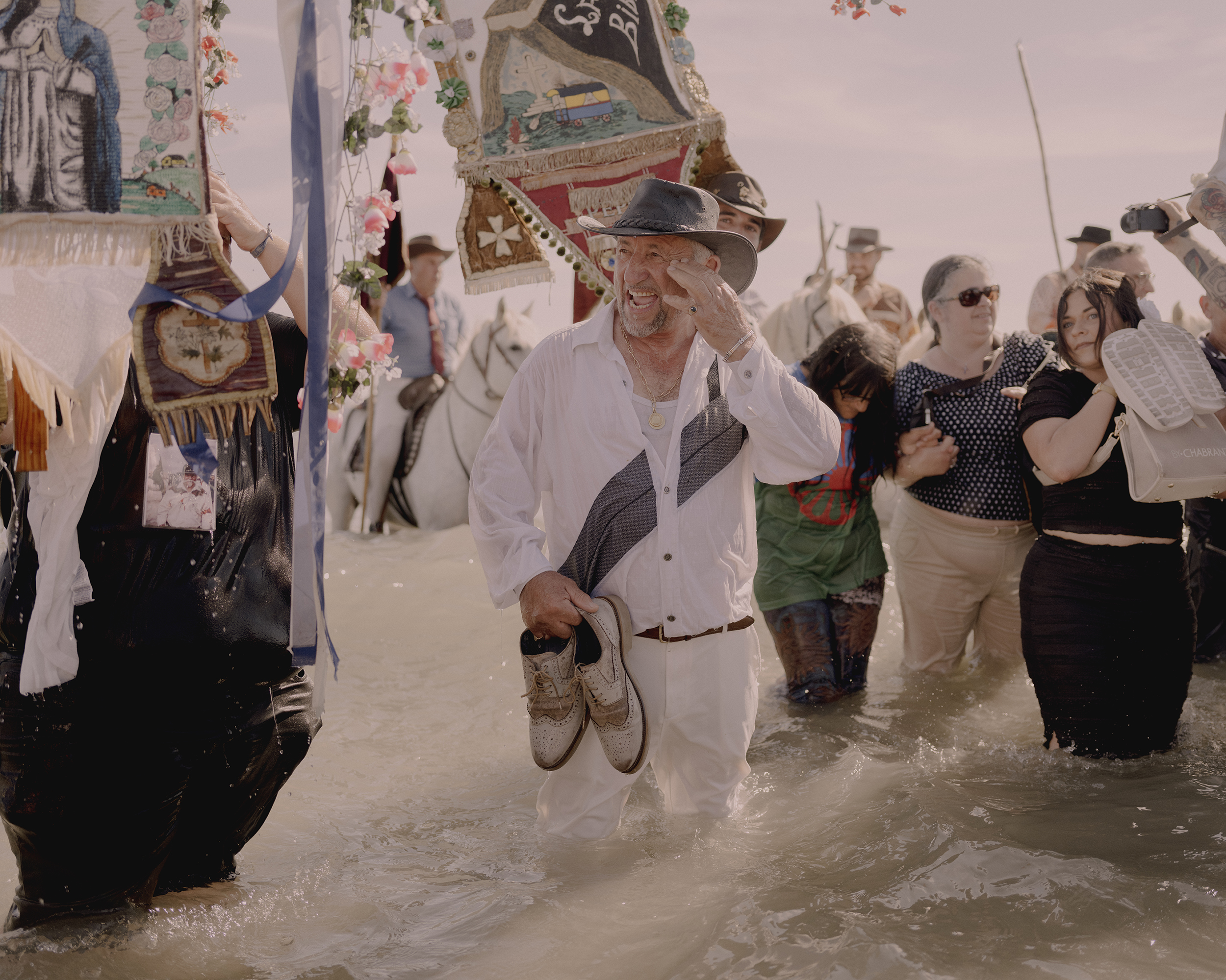 Waves crash into the procession crowd 