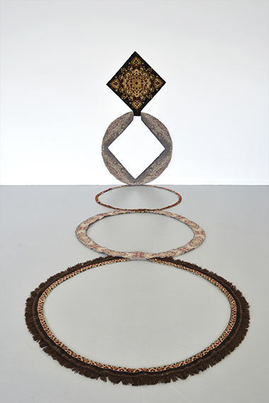 The Origin of the Circle, 2015. Sculpture, sectioned rug, 1.5 x 150 x 190 (wall section) and 1.5 x 150 x 360 (floor section)