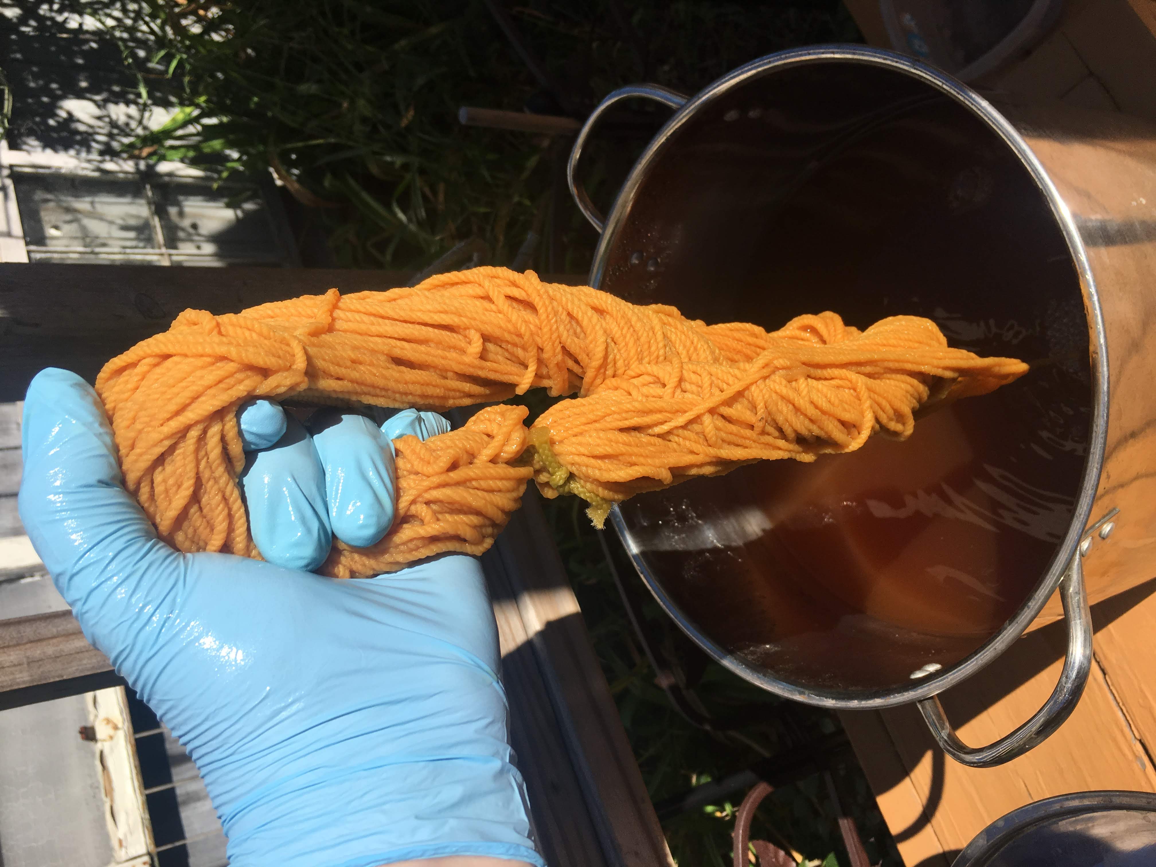 the final product, wool yarn died with roots. The color is a liquid yellow.