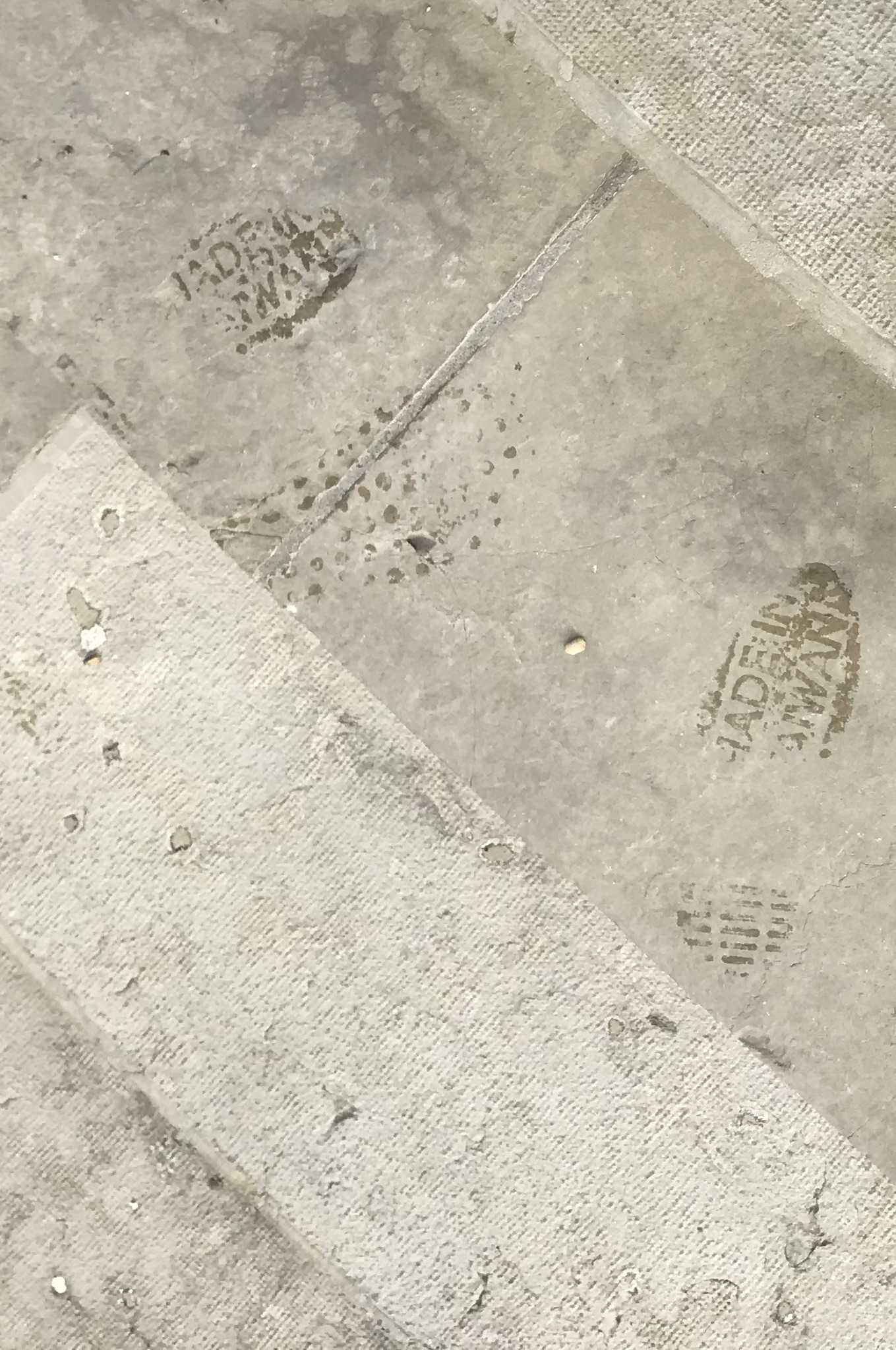 Boots on stone stairway. Geneva, Switzerland. November 2019