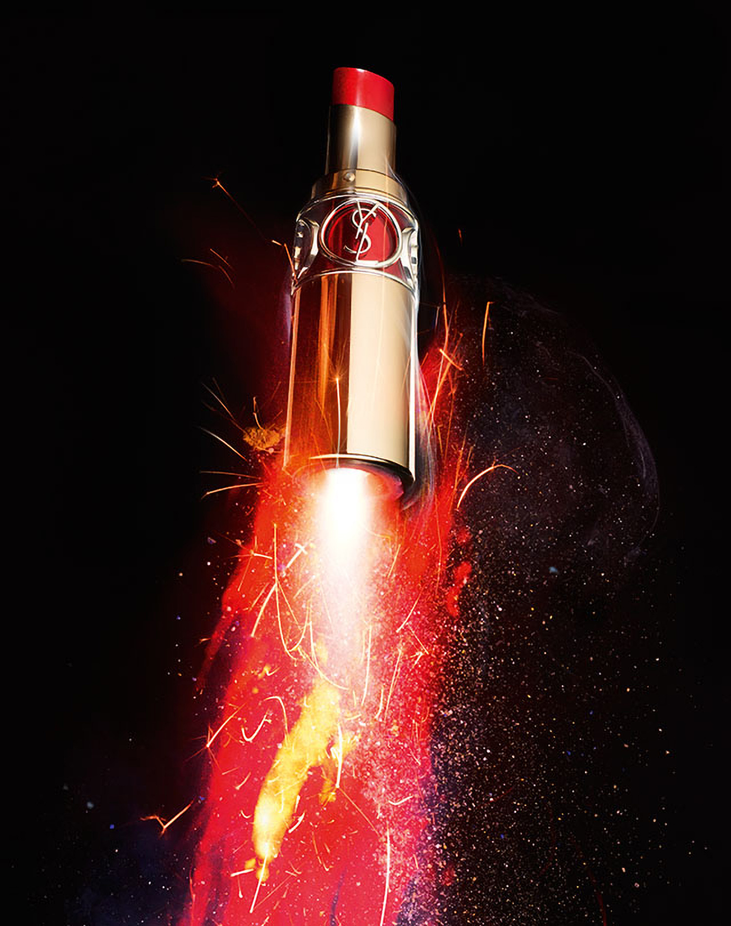 KMA photographer Daniel Schweizer photographs a YSL red lipstick tube with sparks of fire coming from it for No Name Magazine
