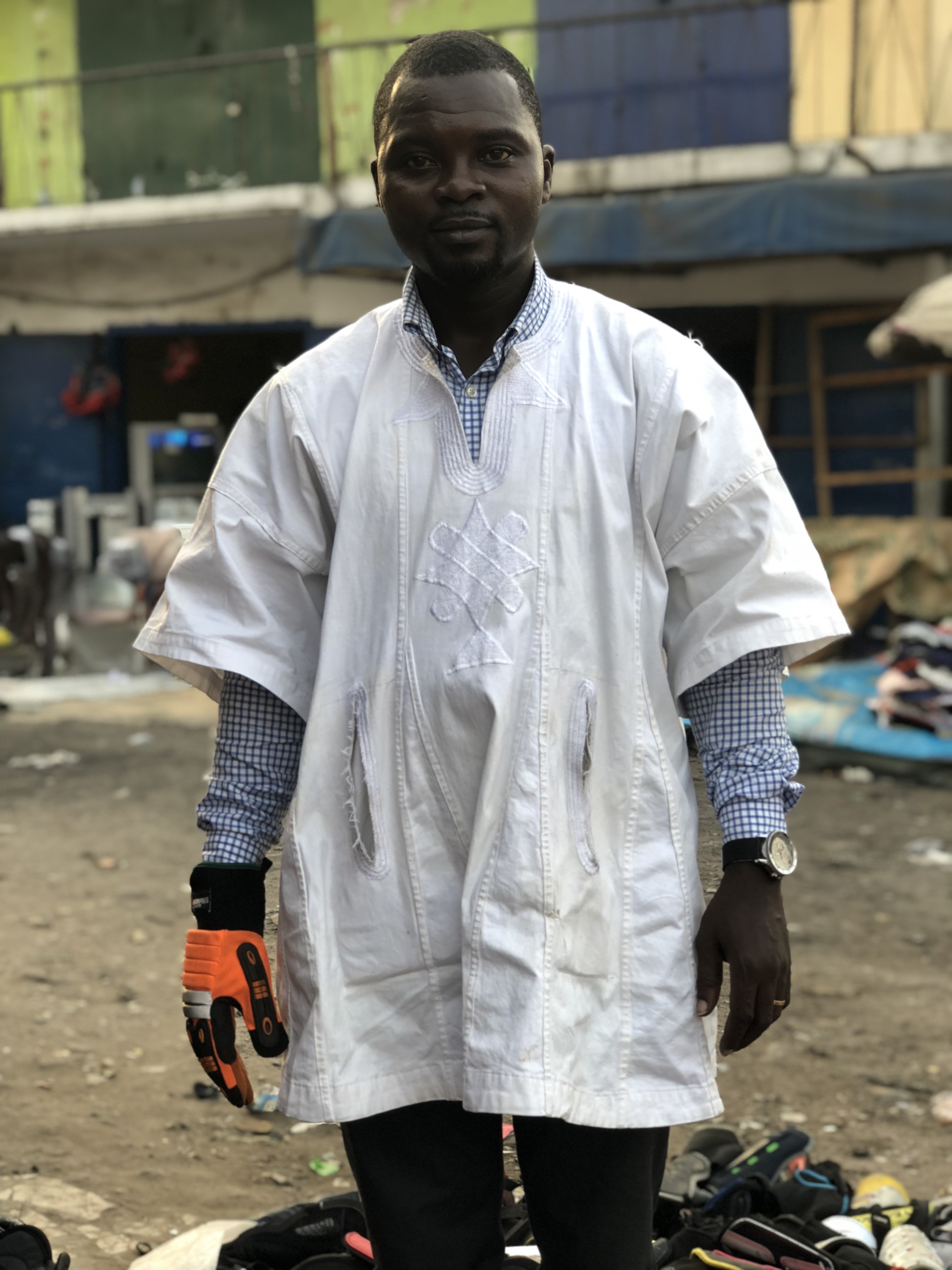 A customer sorting through the second selection of accessories. He found his matching glove! Accra, 02.12.2019