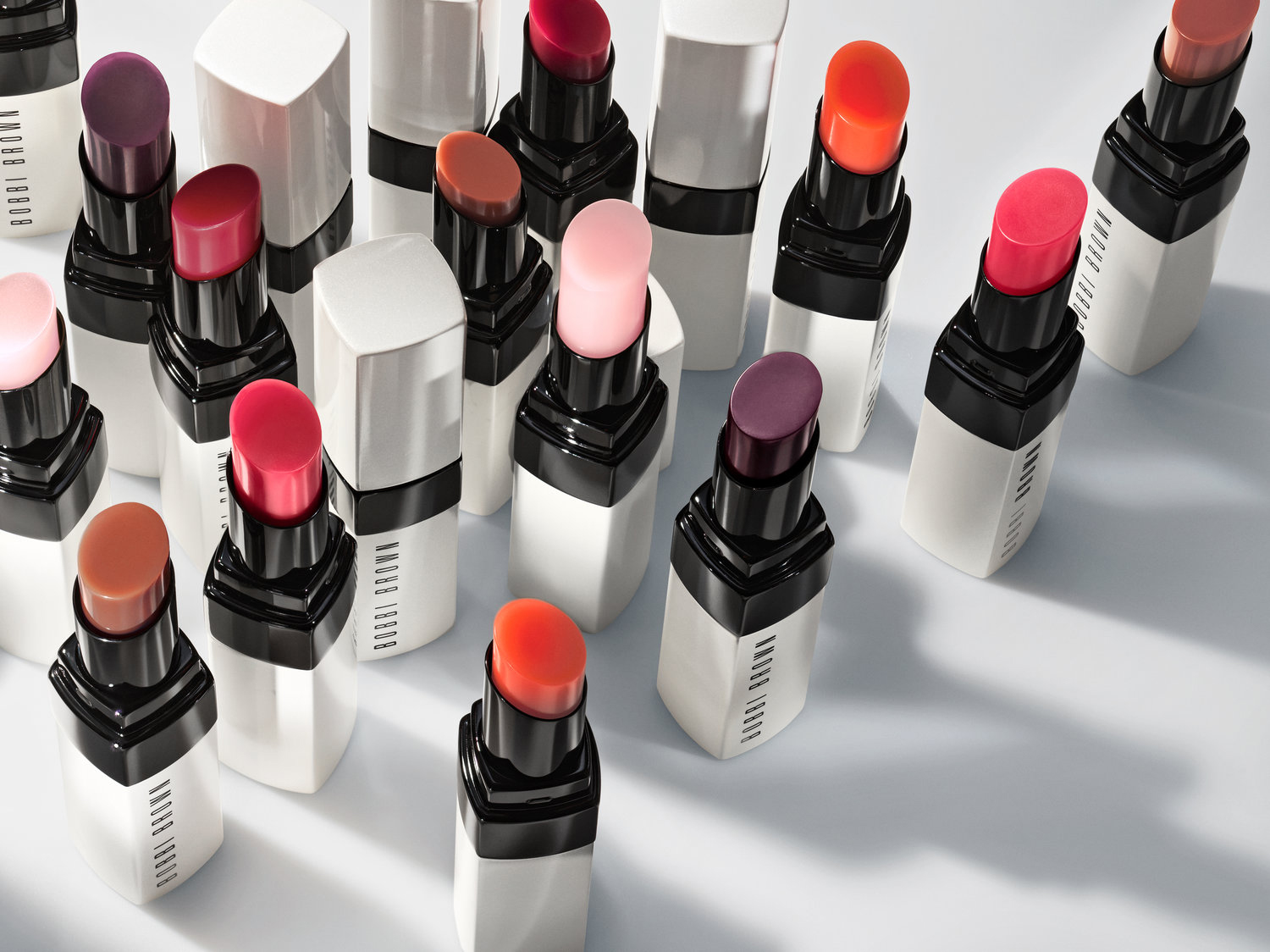 KMA stylist Rachel Haas designs set for photo of several shades of lipsticks against white background for Bobbi Brown