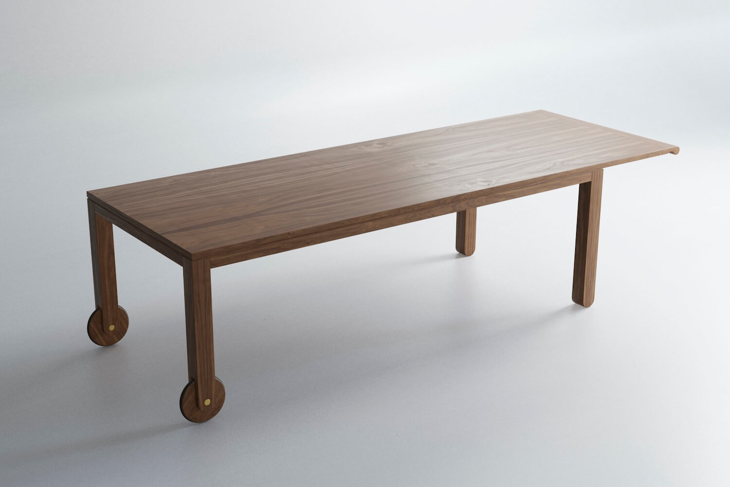 A large contemporary table in walnut