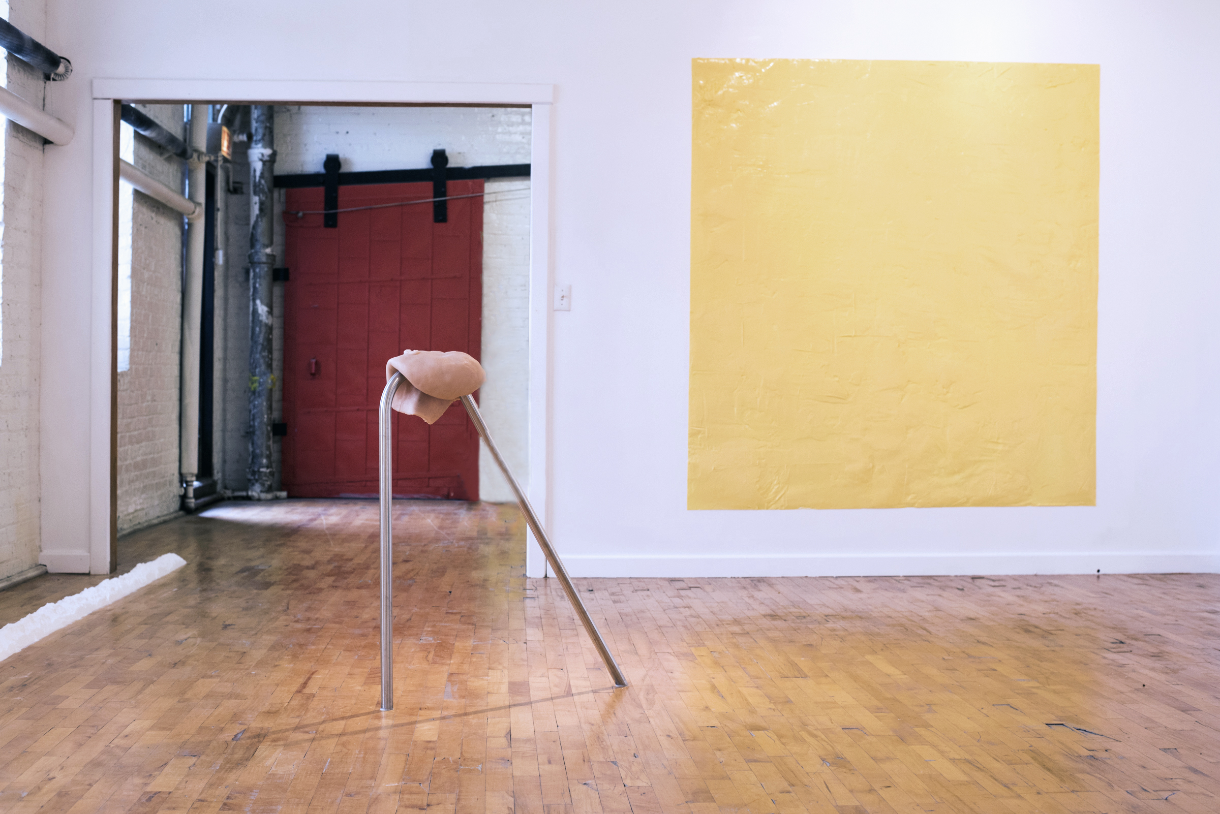 4/4 — BUTTER SQUARE(S).  Butter Square. 6.12.15 Site-specific installation; 35 lbs. margarine, 72" x 80", wall; installation image from the exhibition "Body Mass Index", also left corner of image shows work A Wall of Flour. 6.12.15. Both works 2015.