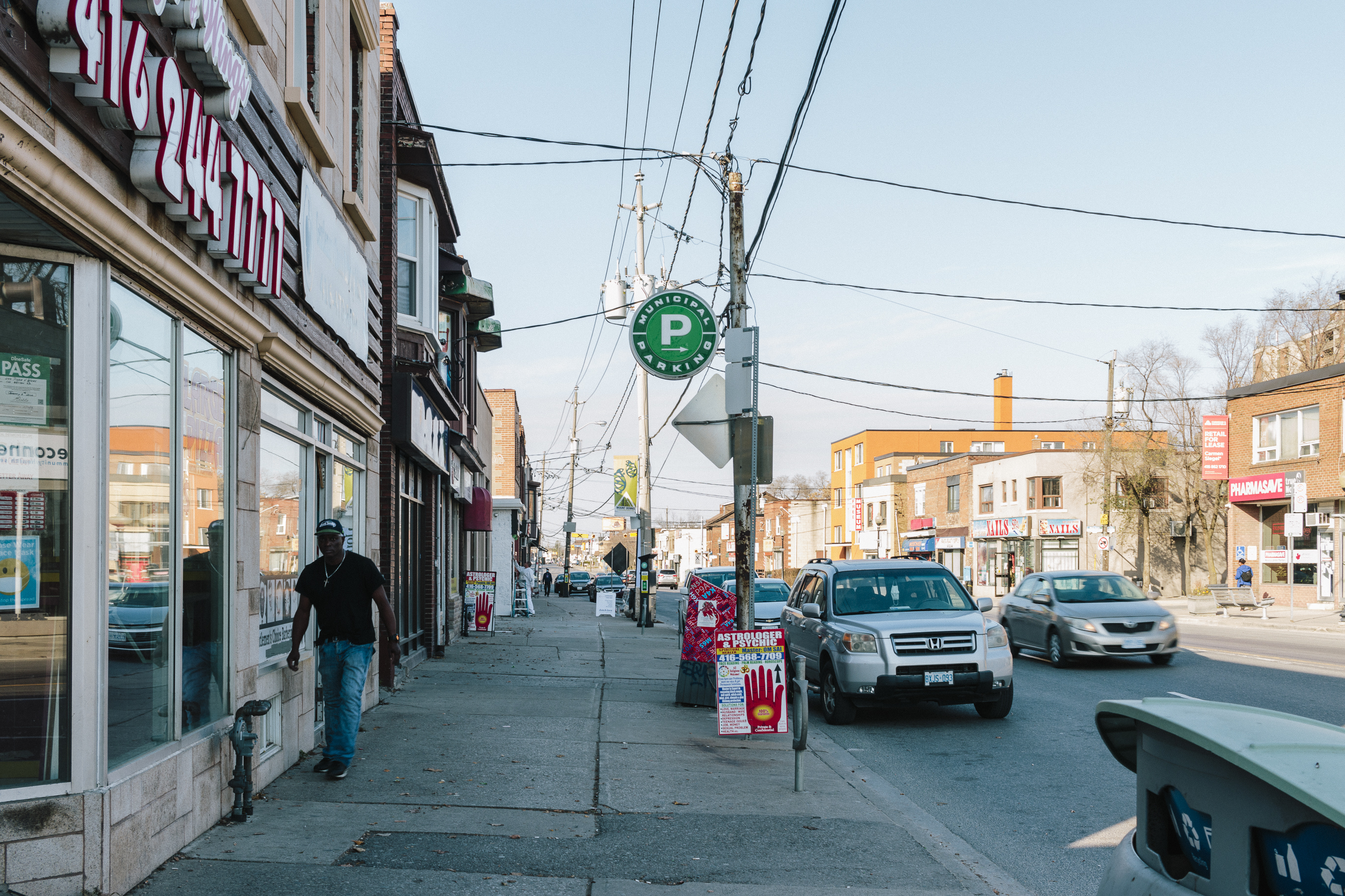 Reduced sidewalk but potential to transform the car parking lane into dedicated bike lanes.