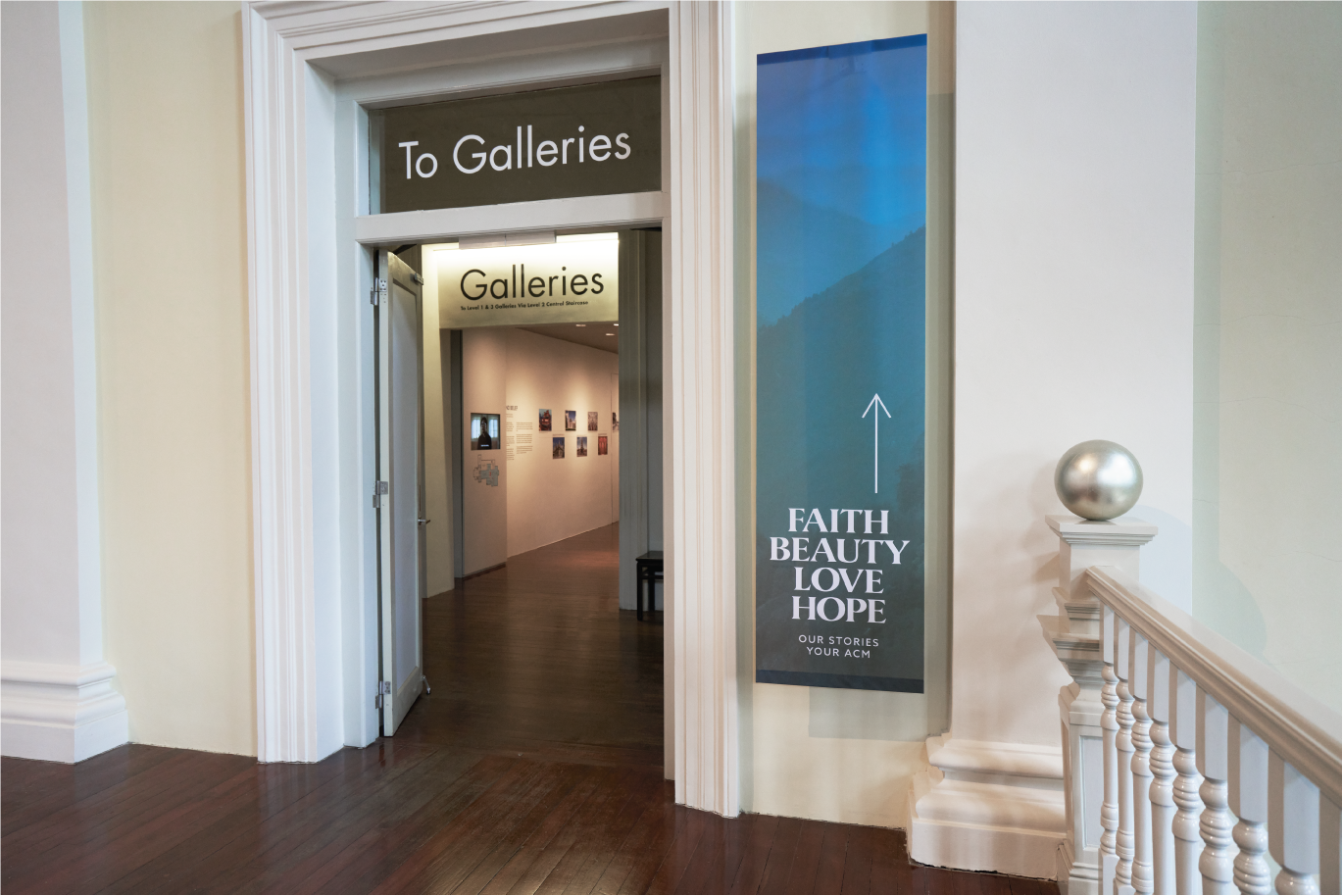 Wayfinding that uses banners to match the entire identity of the exhibition