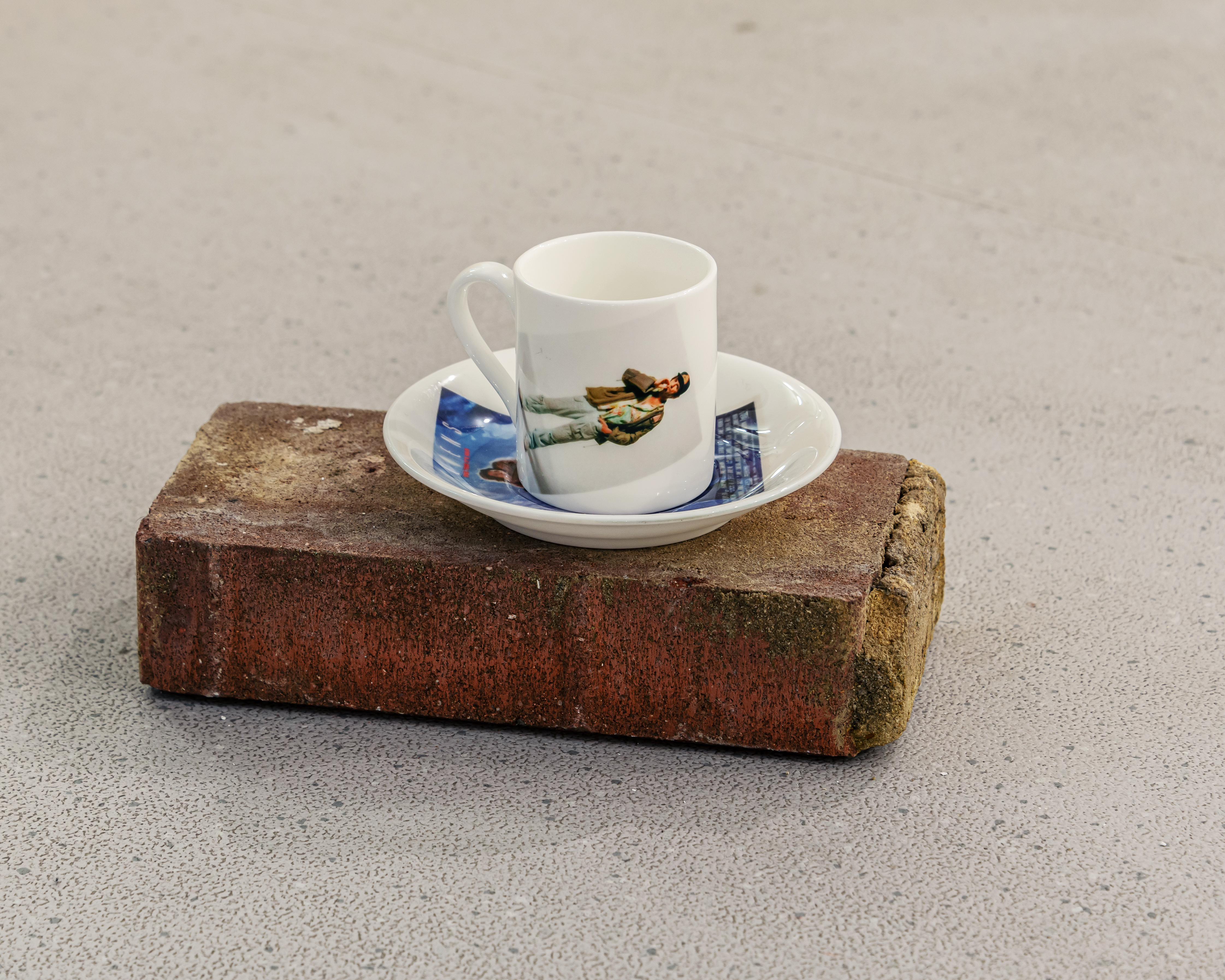Harry Dean Stanton Stars as Brett, 2023, photographic print on espresso cup and saucer set, on red brick, 12x21x12.5cm