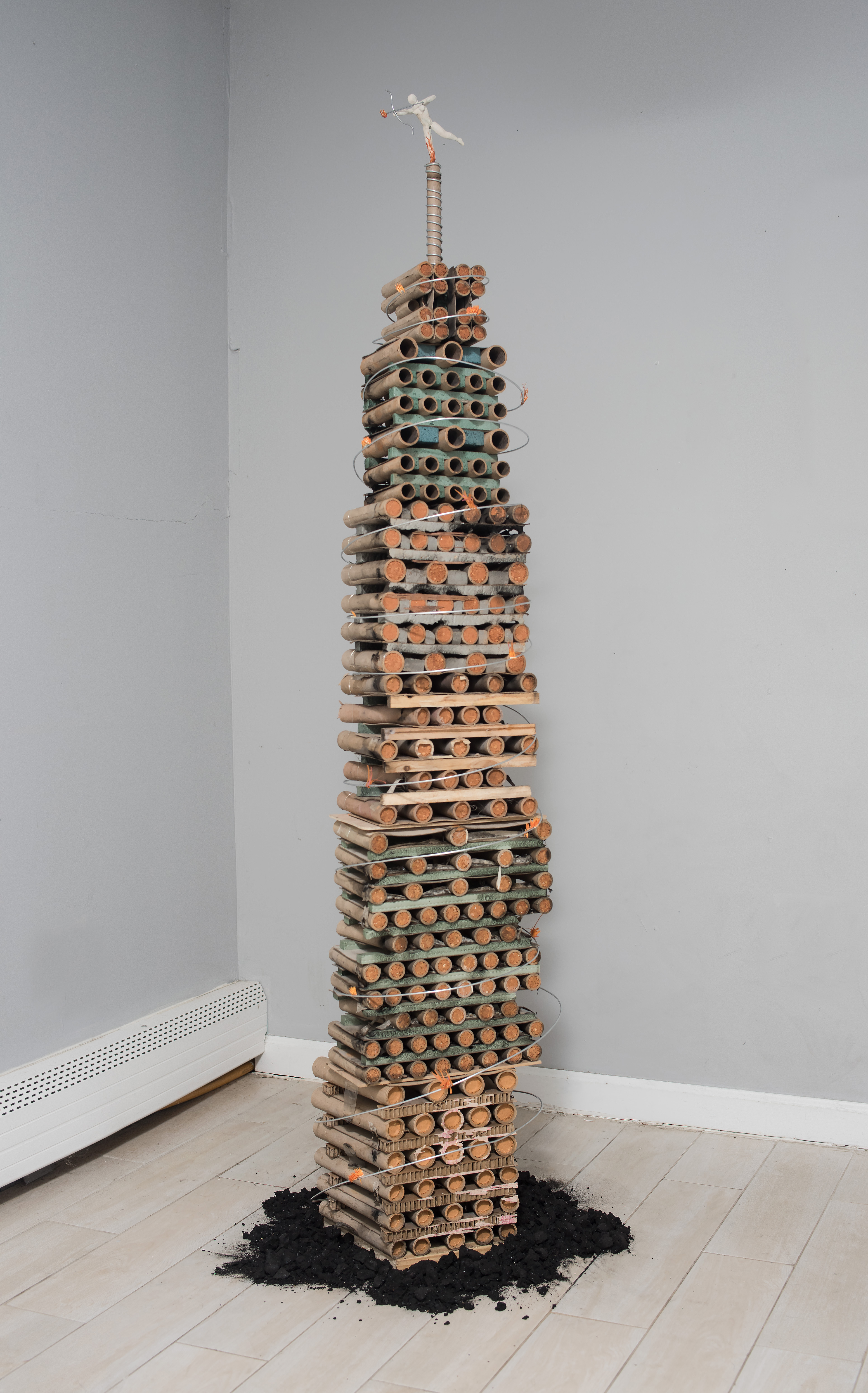 Fire Tower, 2023, Found firework refuse, charcoal, wire, wood, dried thistle, aquaresin, 12" x 72" x 12"