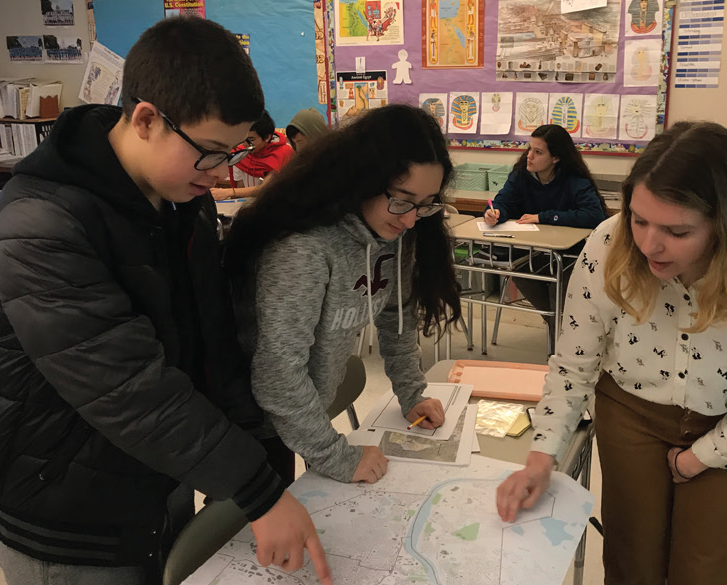 Student leading an engagement activity at Dr. An Wang Middle School