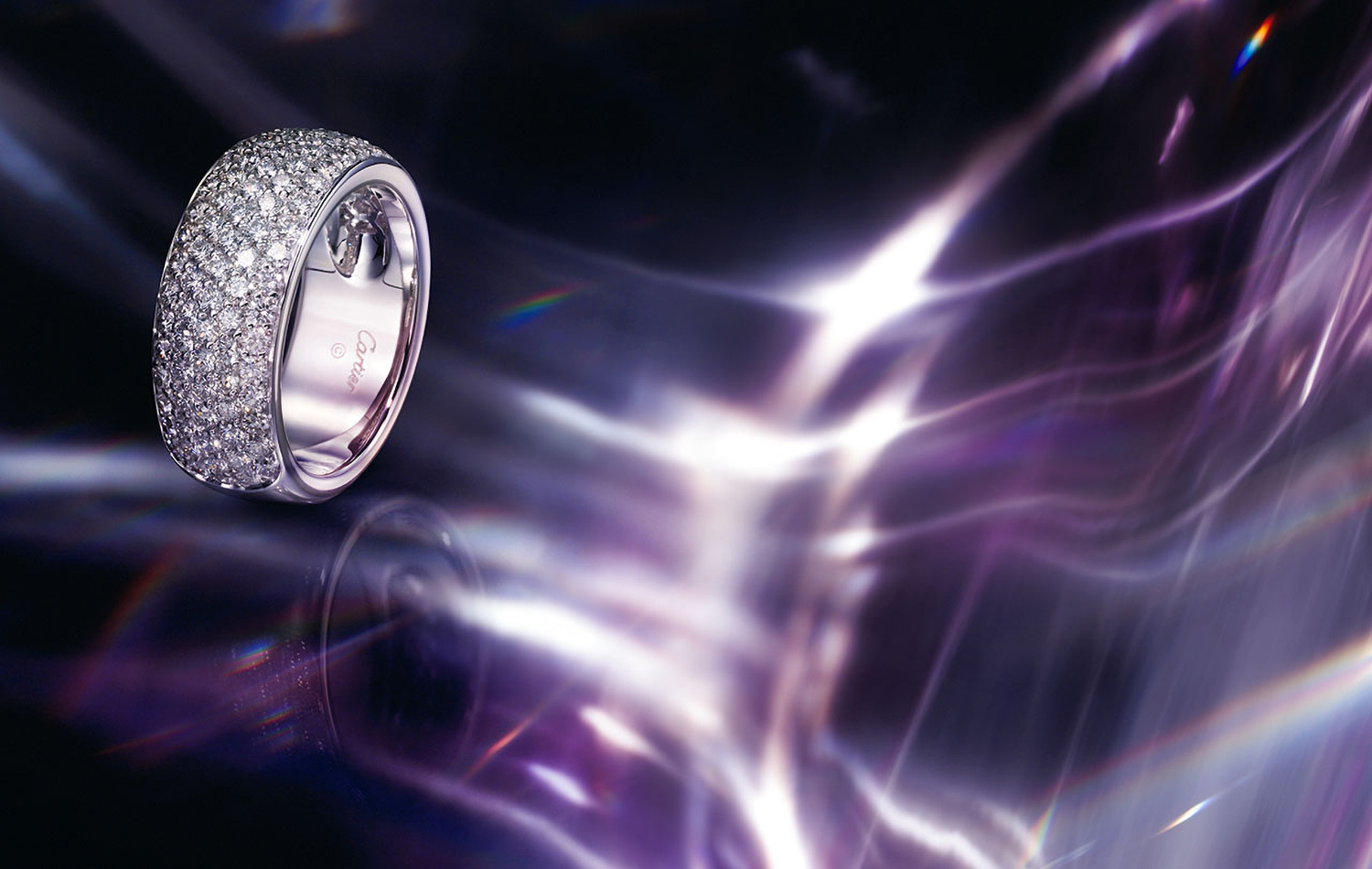 KMA photographer Daniel Schweizer photographs a ring with rows of diamonds for Cartier against a purple shimmery background
