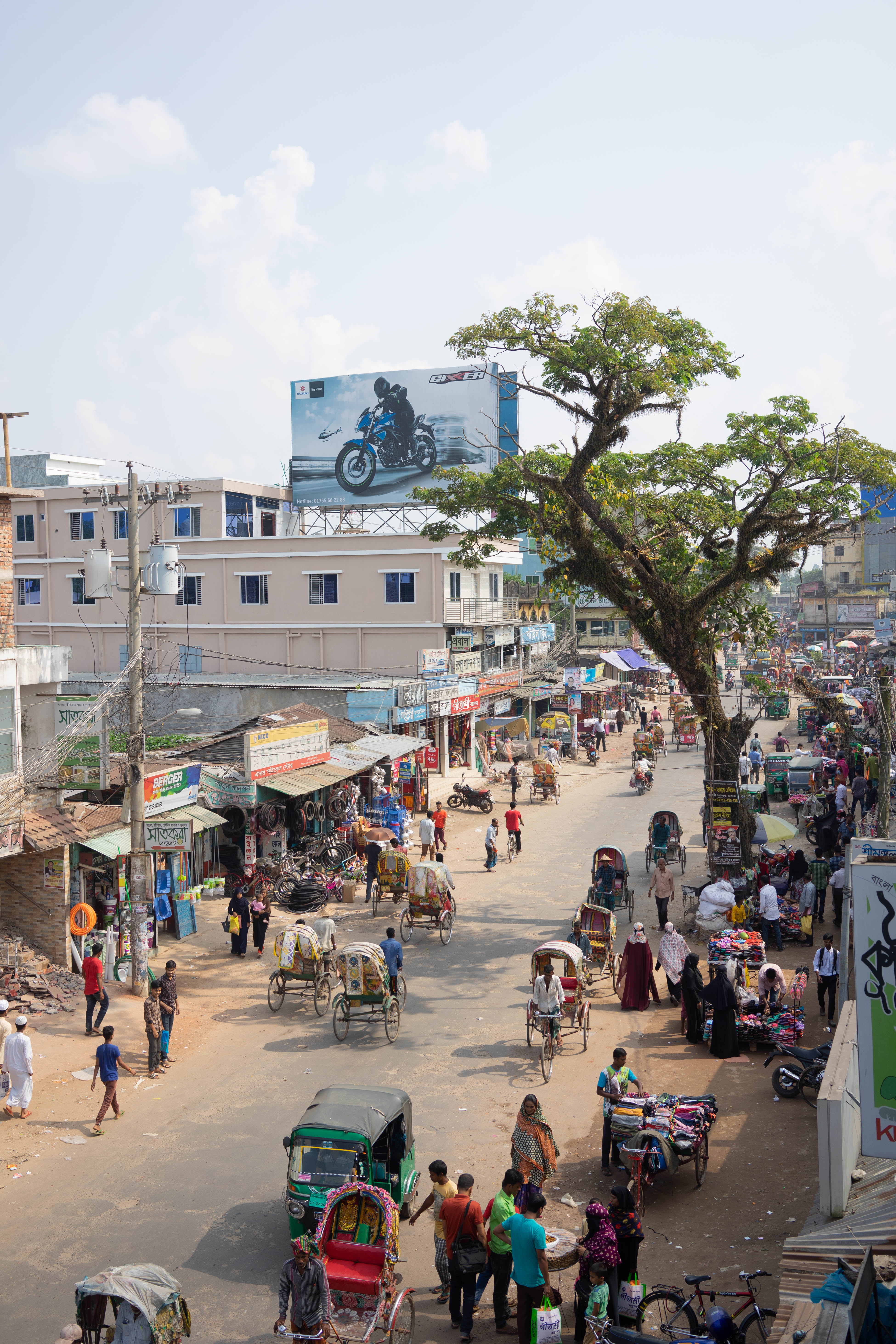 A busy market street near Chittagong, Bangladesh. While cash payments are still common on market streets such as this, Bangladesh is emerging hub for mobile banking innovation. Many are pioneering ways to merge development with mobile communication to enhance health and finance outcomes. 