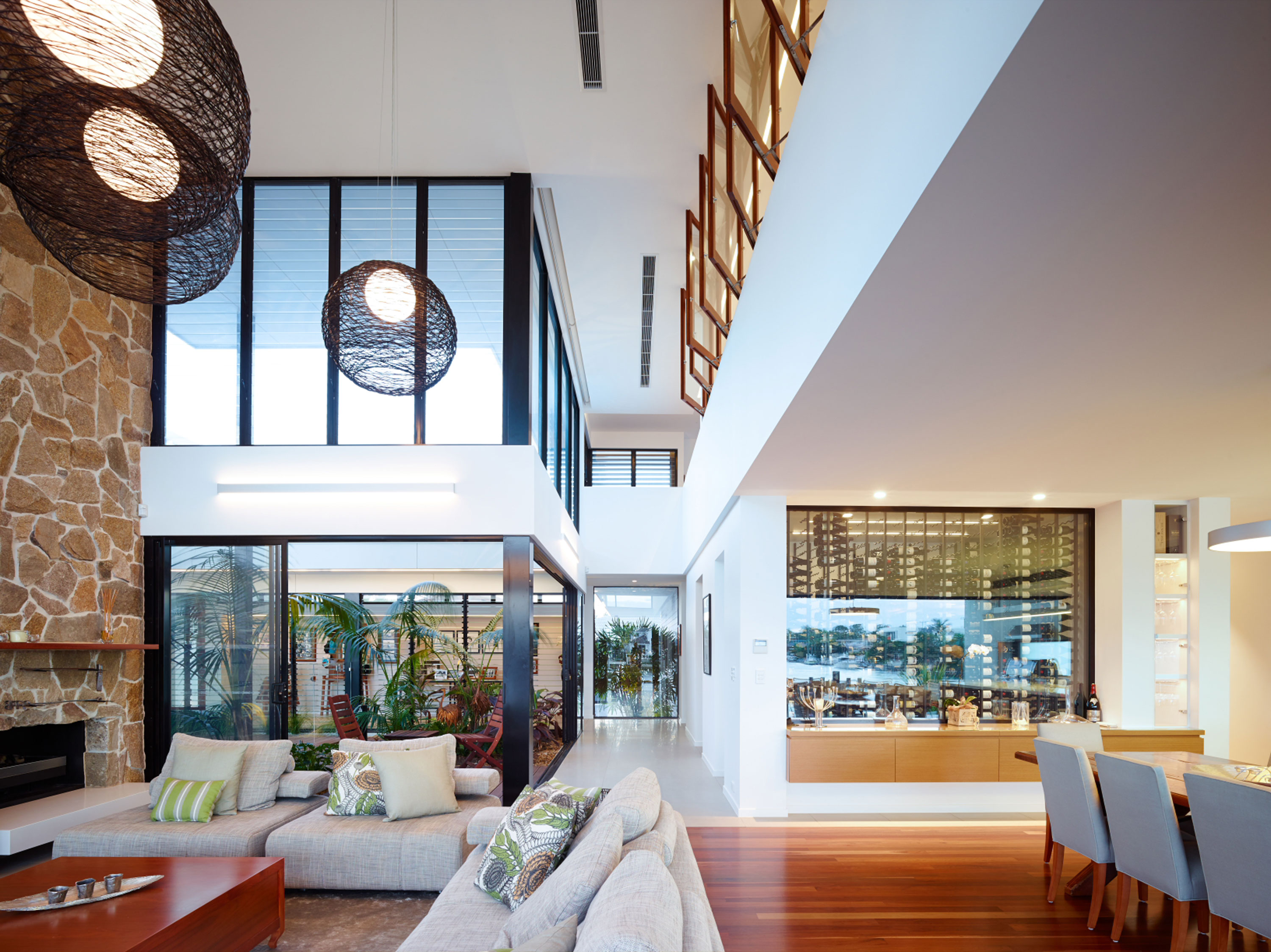 A contemporary living space with a fireplace and wine cellar, perfect for entertaining.