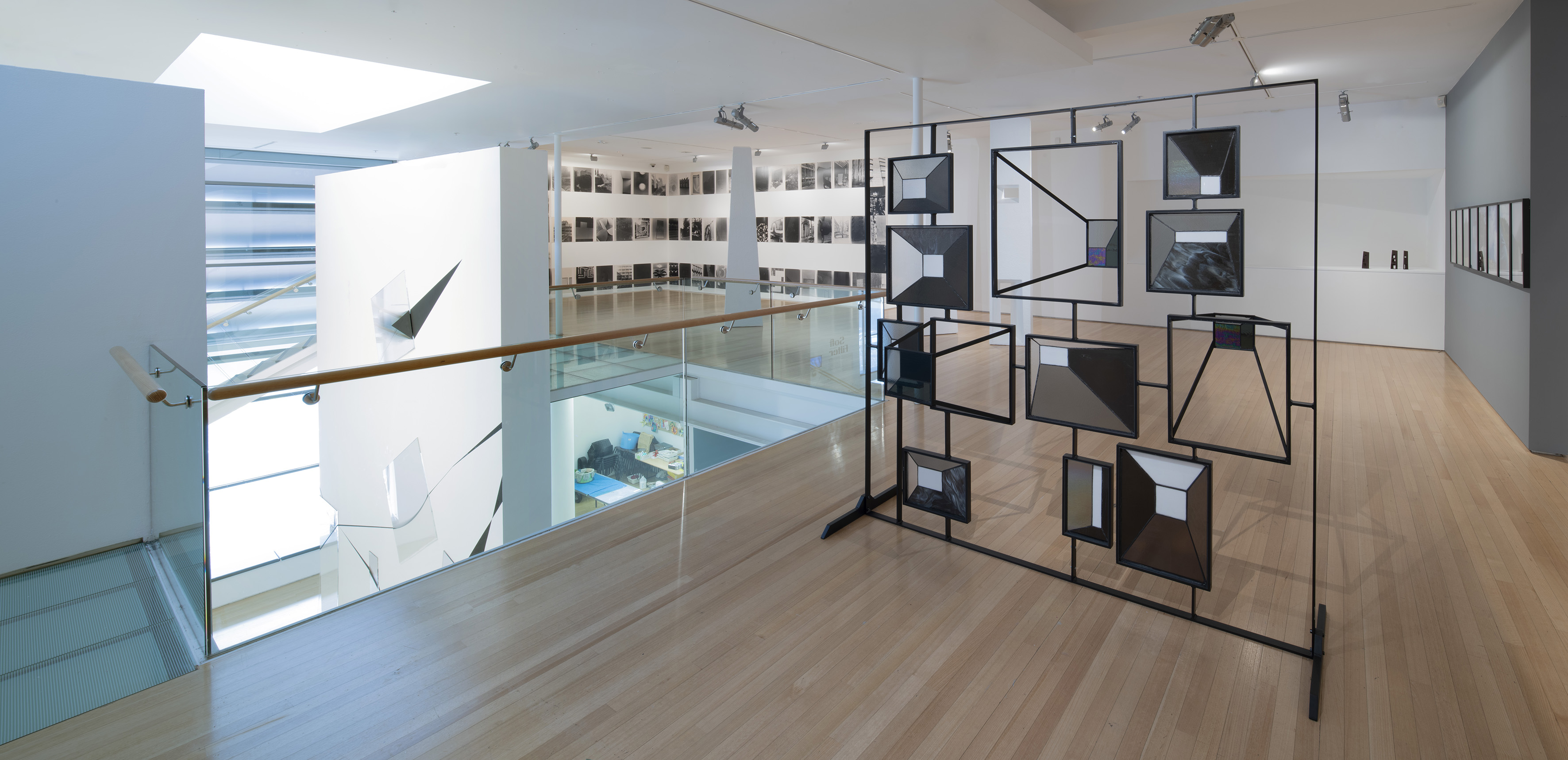 Transformance, 2021, stained glass and powder-caoted steel, 2m x 2m x 1.2m Gavin Hipkins photographs behind.