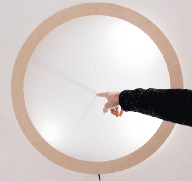 Vienna design collective Breaded Escalope has created a clock that uses shadows to display the time when a finger is placed in its face.