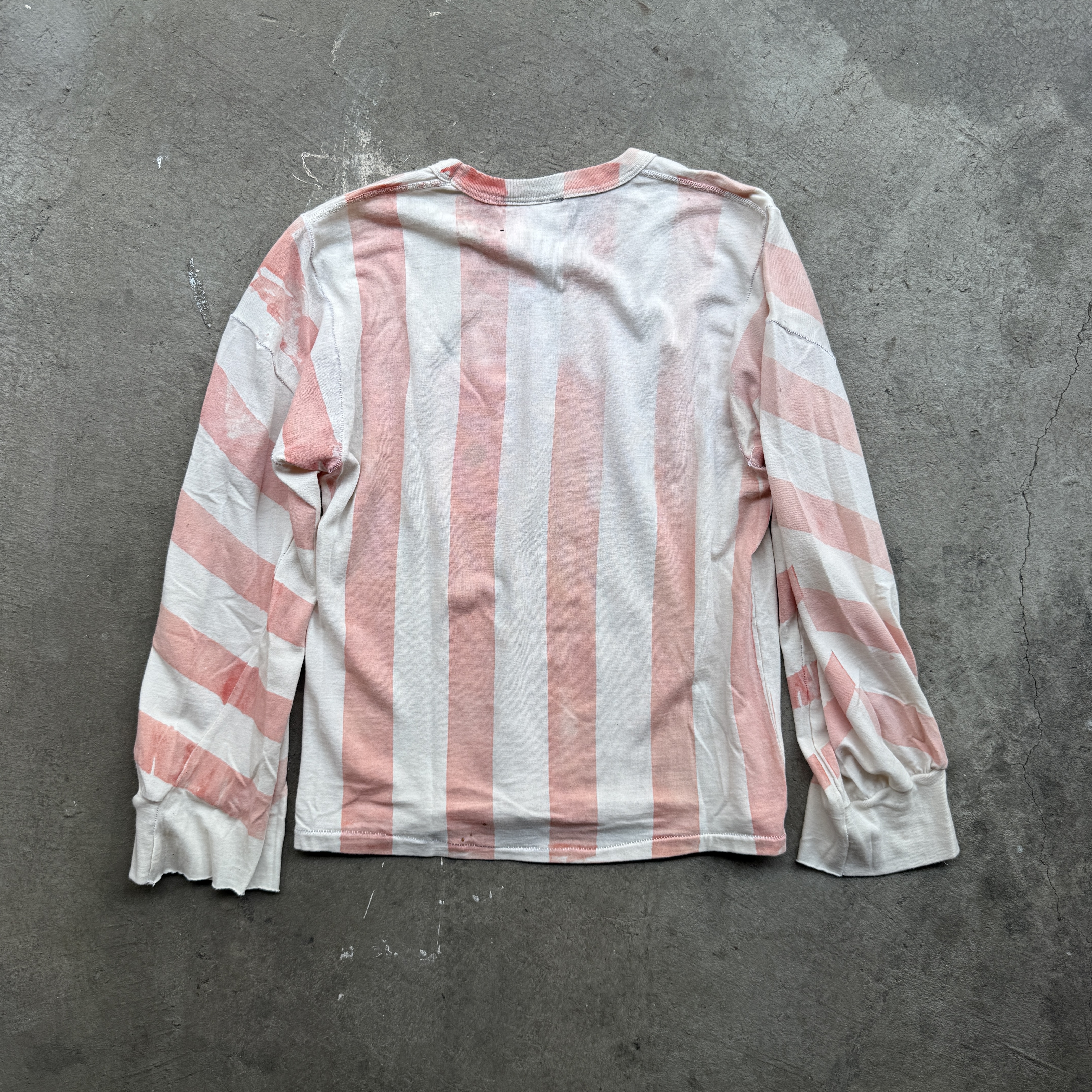 Reclaimed vintage surplus thermal shirt tailored to have boxy fit and wide sleeves. Allover printed with stripes using thermochromic ink, which changes color when exposed to heat.