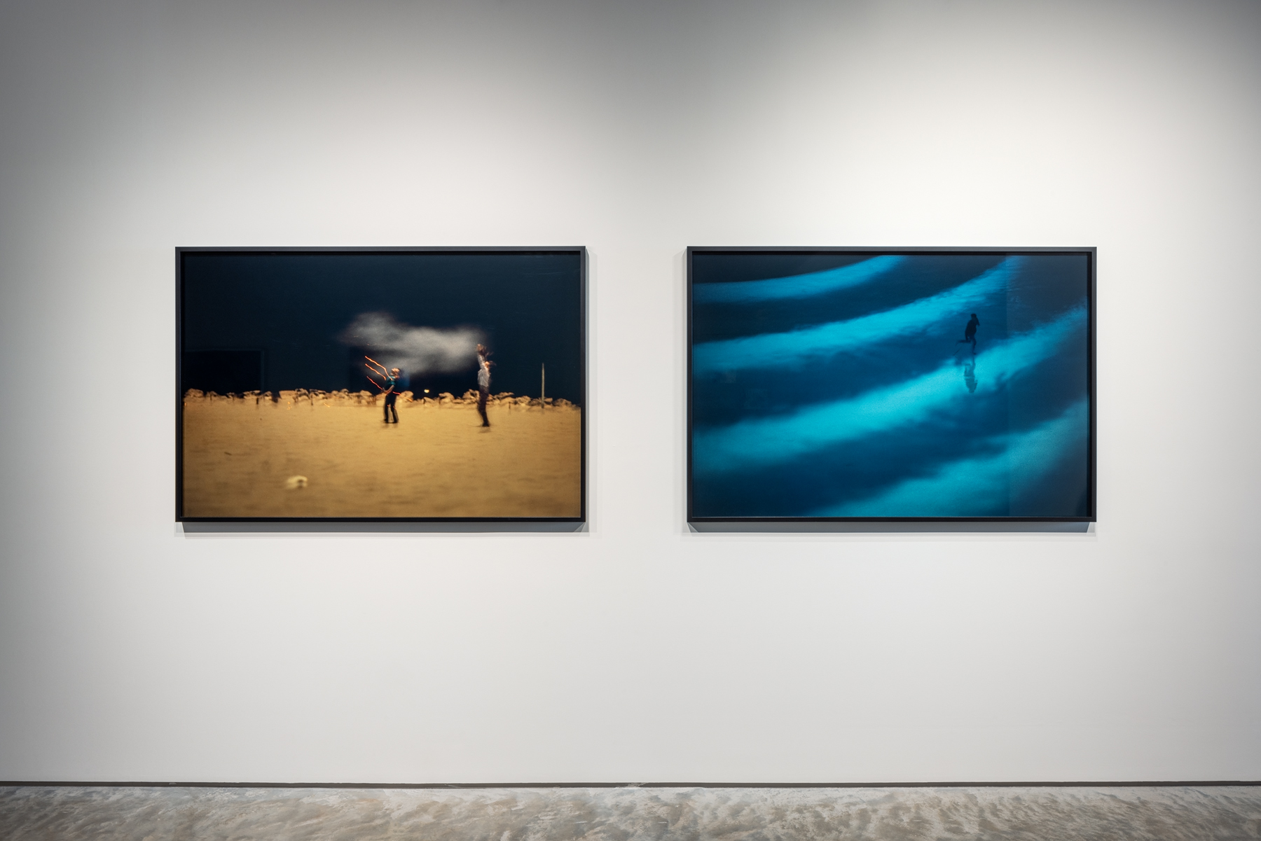 Left: Robert Blake, "Legend - Light Strikes, les Saintes Maries de Provence," 1988. Fujiflex, 40 x 60 inches. Right: "Legend - Untitled (figure jumping over waves)," ca. 1988 - 1998. Fujiflex, 40 x 60 inches. Photo by Rafael Gamo. 