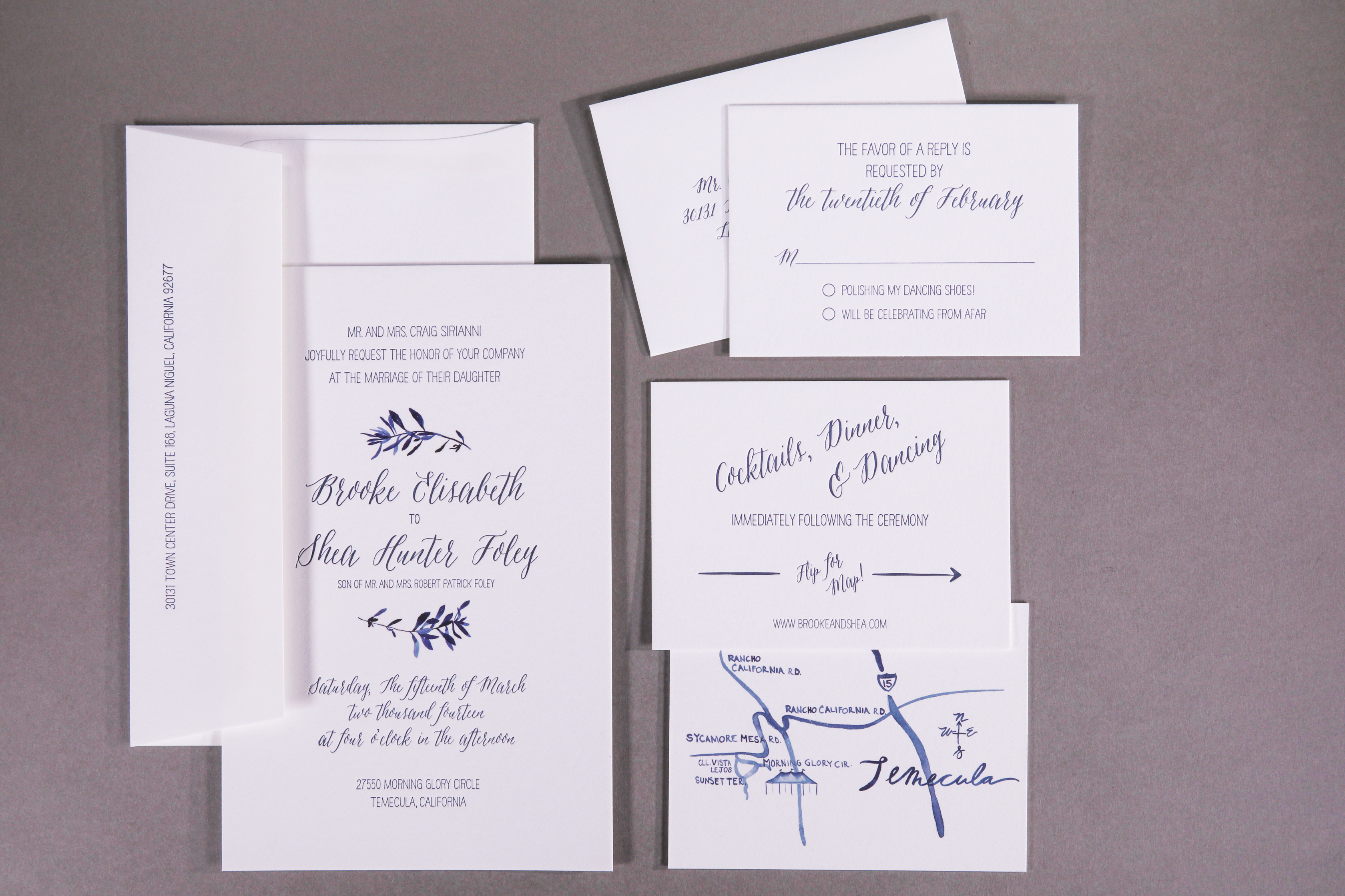 Brooke & Shea wedding invitation Blue olive leaves and map digitally printed.Text letterpress in blue.Paper Savoy in brilliant white