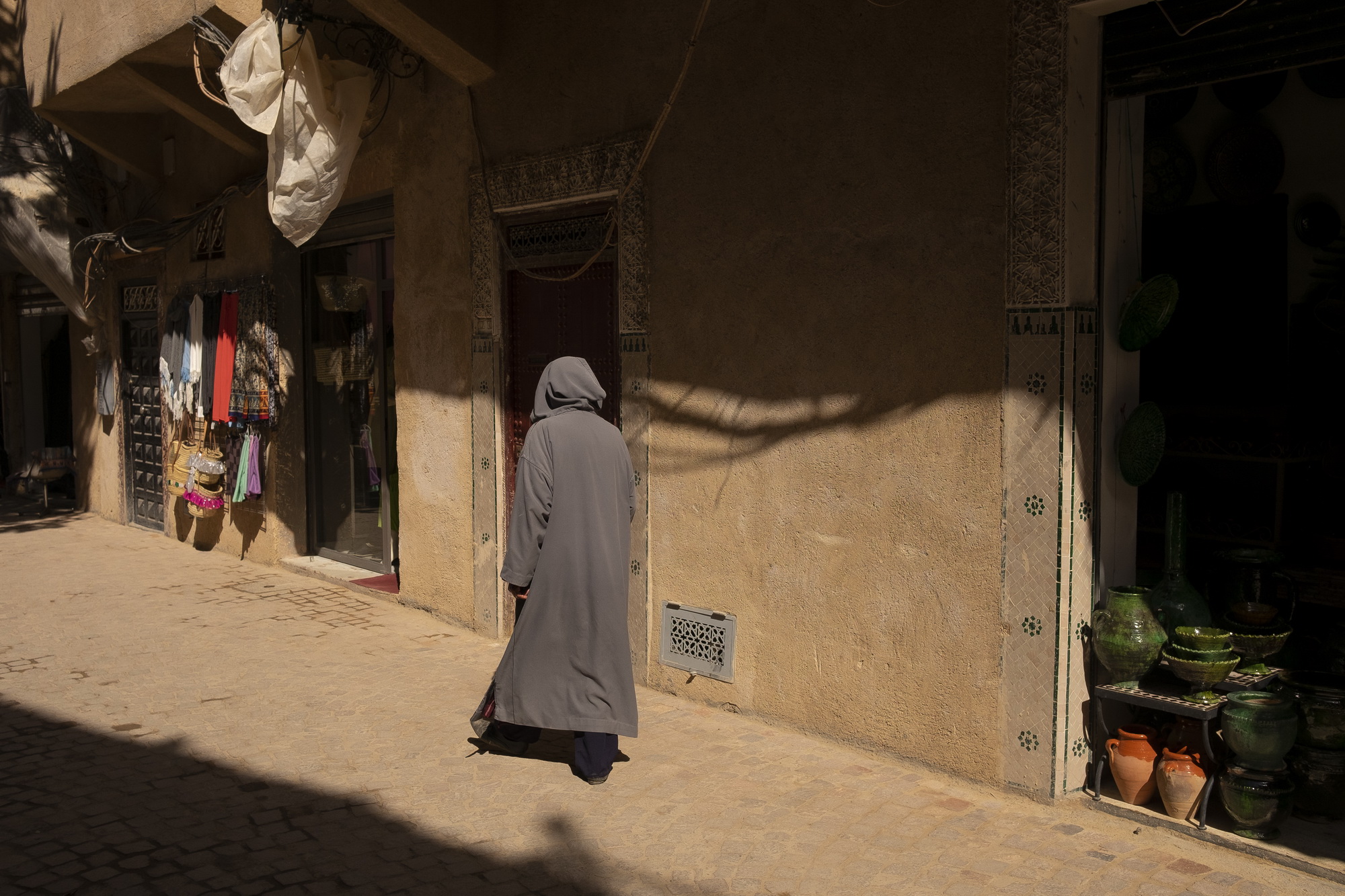 Due to dry and desert climate almost everyone wears djellaba.