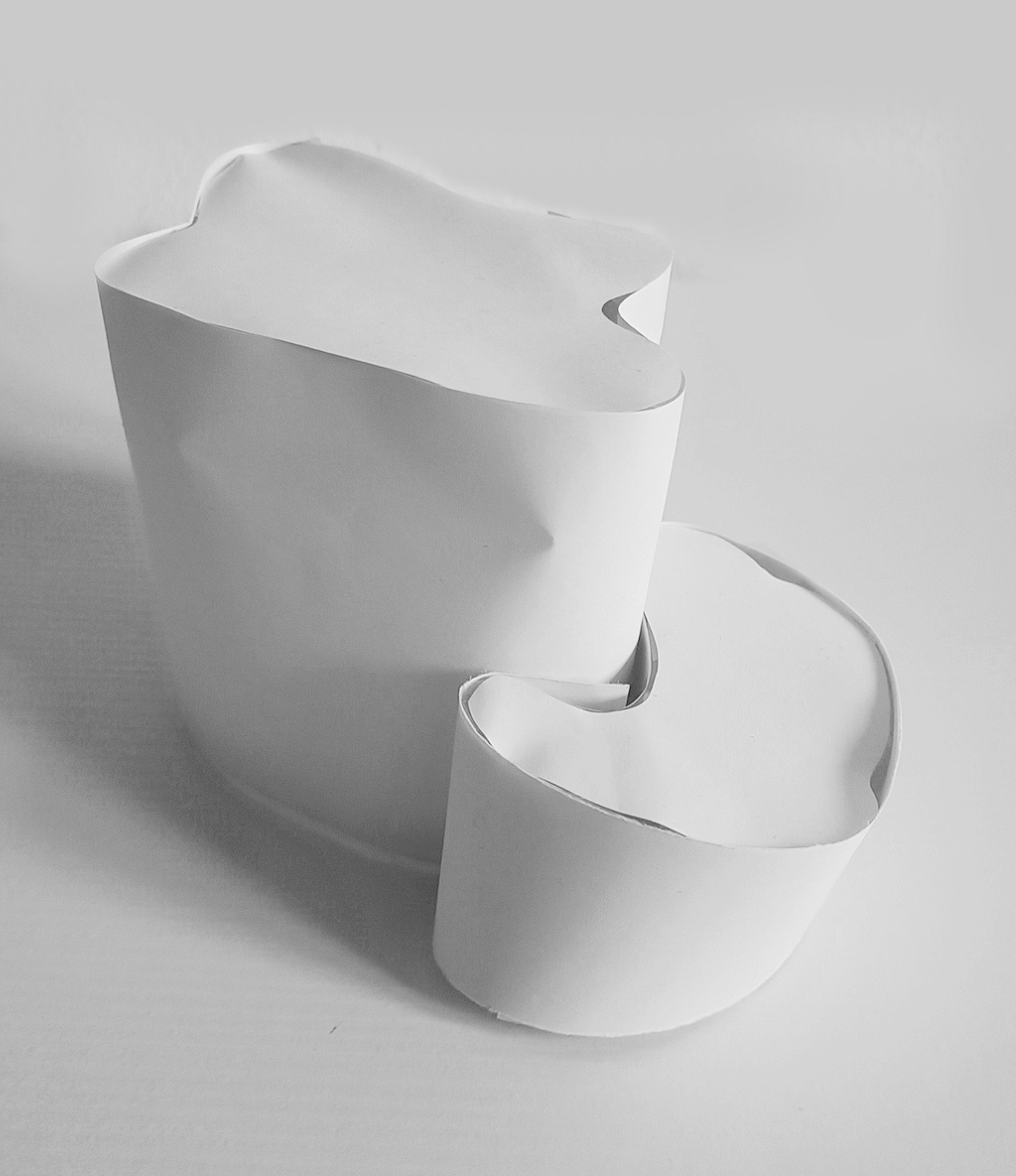 The second structure resembles artificial structures with a hint of curvature. The two interconnecting pieces form a uniform block. This form was inspired by bunkers being described as fortresses. The stability allows for comfort through knowing that they would withstand and attach, thus connecting the military camo pattern to associate camouflage with physical protection.