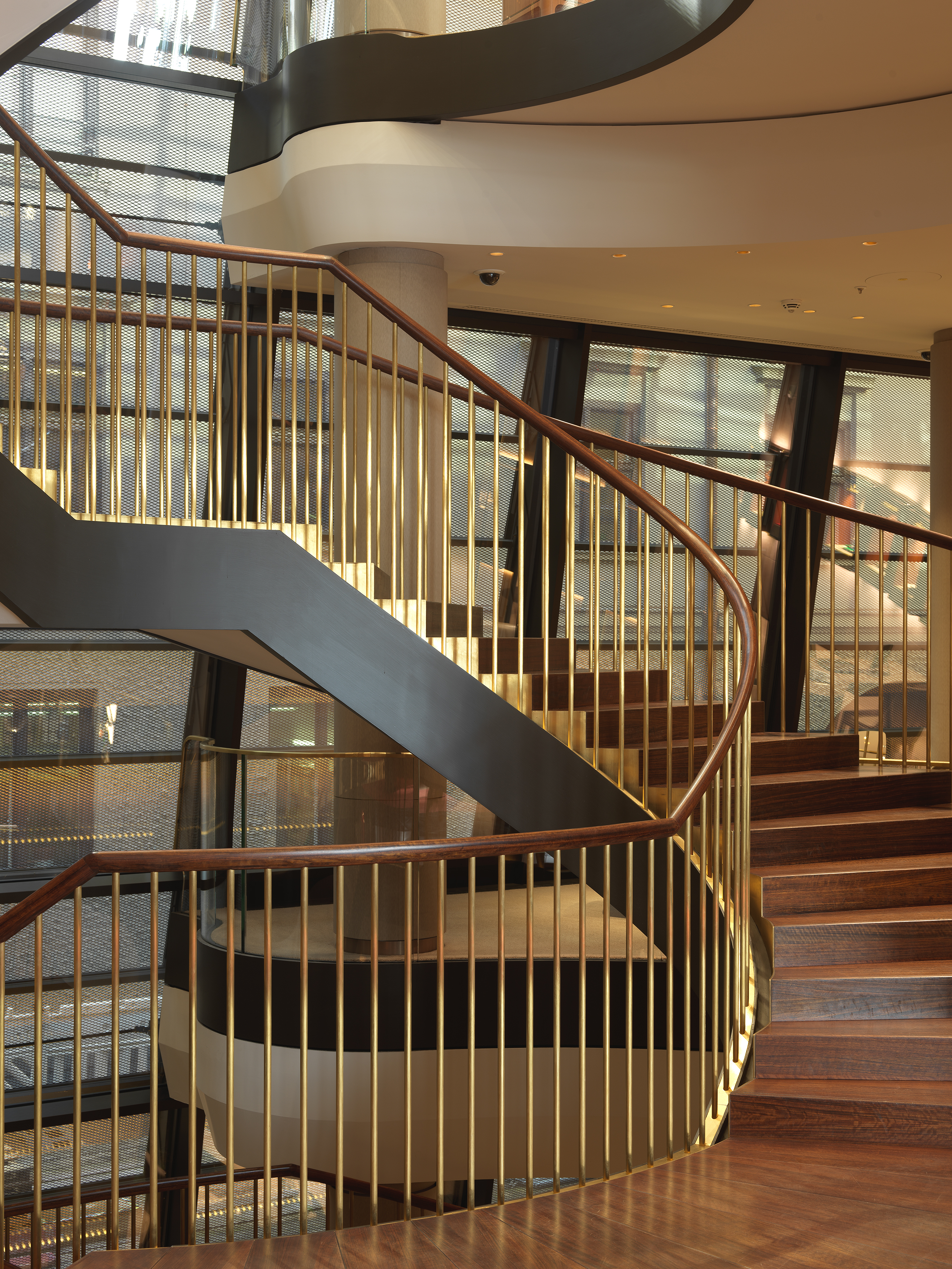 1/7 - Ellipsoidal spiral staircase that connects all three floors.