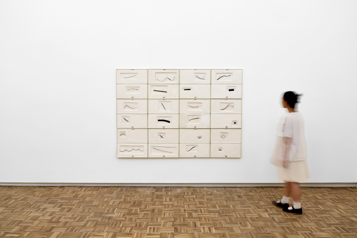 Jared Ginsburg, rubber index (2025) | Key cases, resin, string, jewellers wire, rubber, 152.5 x 215.5 cm
