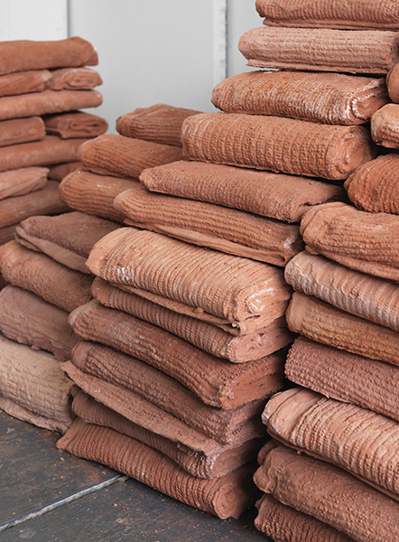 Untitled (towel bricks), 2015, hand towels, plaster, pigment, brick dust