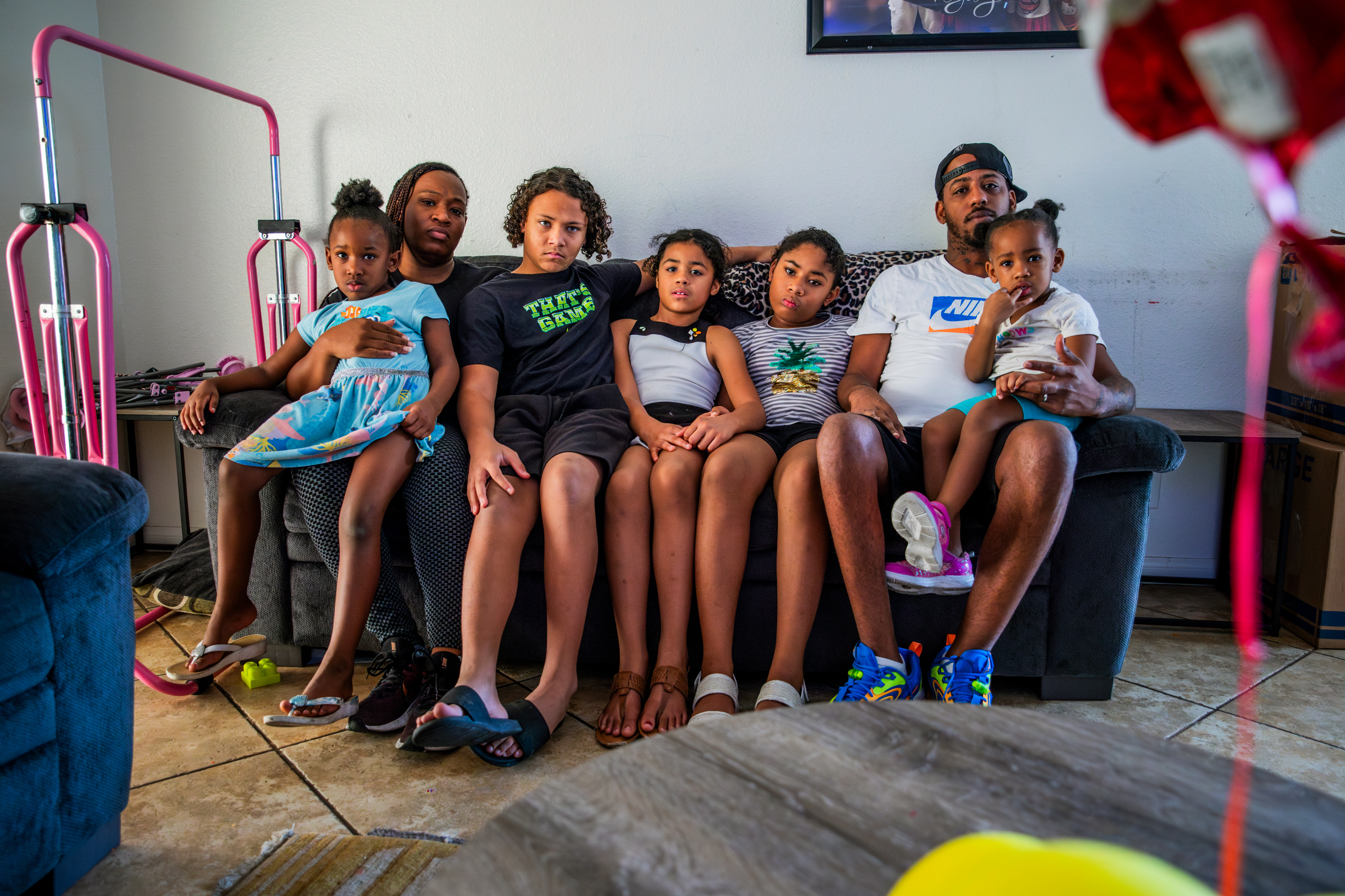 Tawana and Akeem Smith with their children Mya, 5, Malakai, 12, Akeelia, 7, Maliyah, 9, and Amirah, 2, in their Las Vegas home. The Smith family has faced eviction several times since the start of the pandemic. (The New York Times)