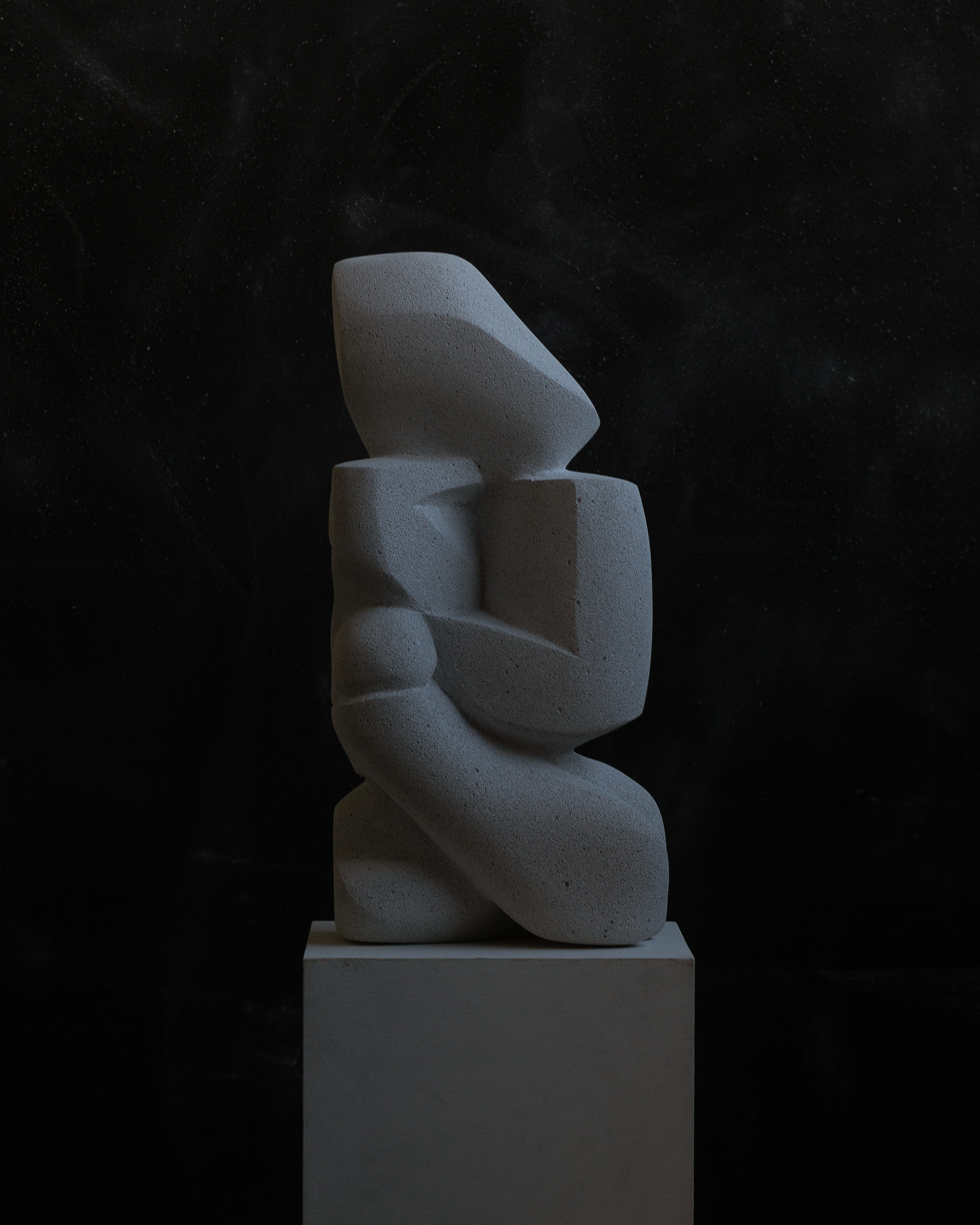 right angled view of Veil sculpture by Benjamin Ewing made out of stone concrete hand carved and sculpted