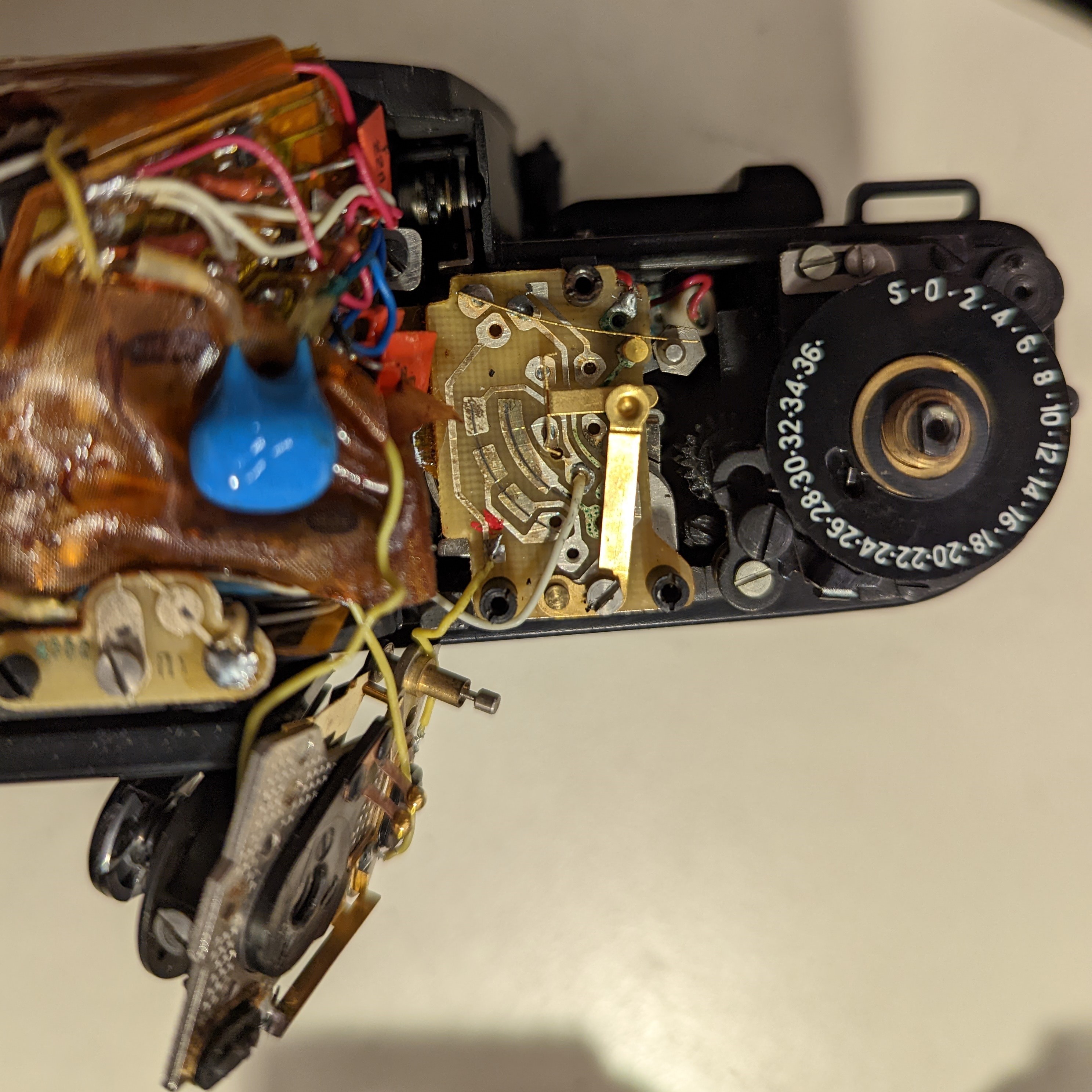 16. Next layer of button mechanism to remove.